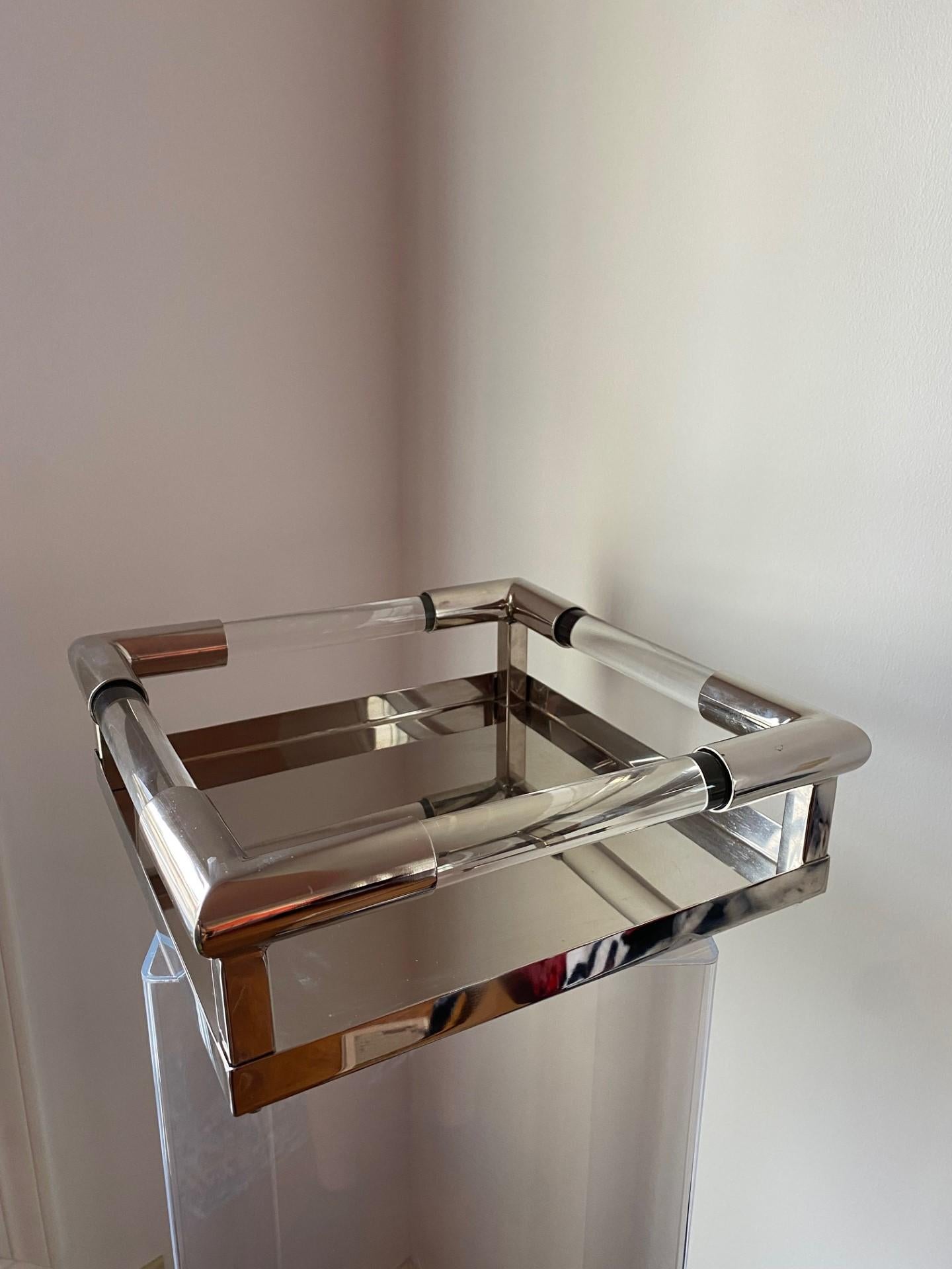 Beautiful and incredibly chic vintage tray.  An original piece that highlights and punctuates your décor.  Featuring a square frame, polished chrome accents and lucite details.  The chrome is polished that it almost mirrors for extra shine, this