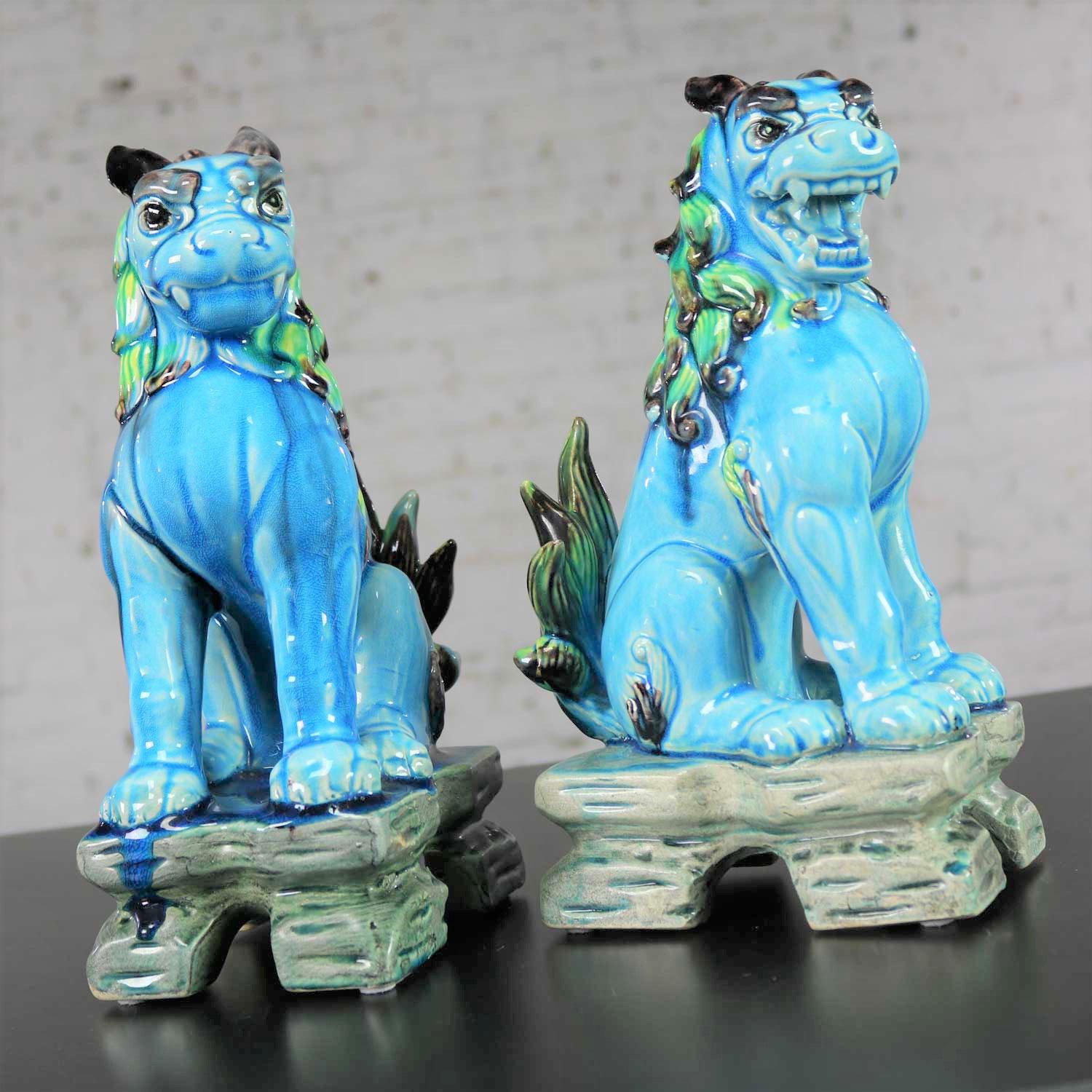 Awesome pair of vintage midcentury Japanese Komainu or Lion Dogs in ceramic with a gorgeous glaze that is primarily turquoise green but mixed with many other wonderful colors of greens and blues and blacks and browns. They are in fabulous vintage