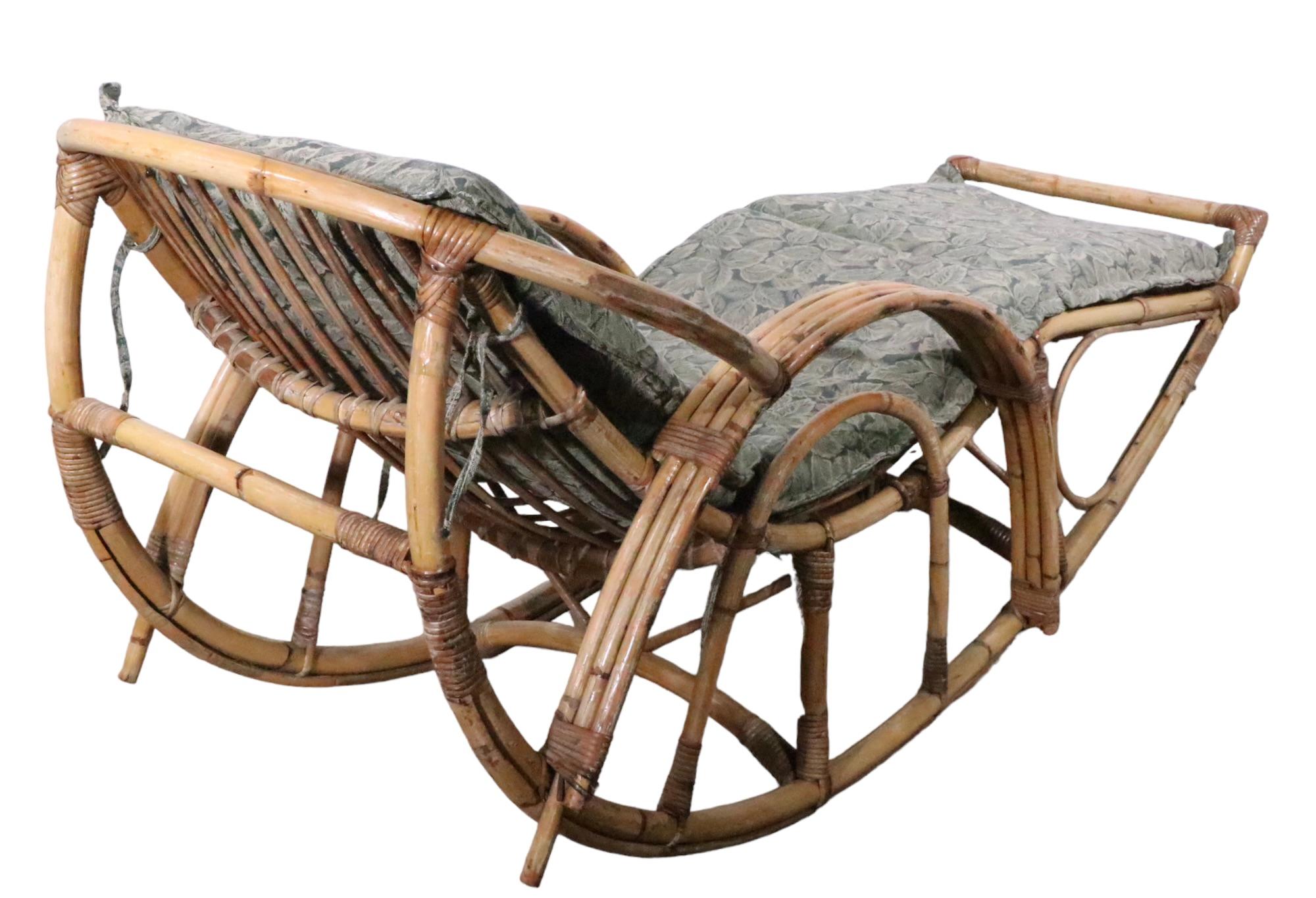 High Style rocking chaise lounge, in bamboo and reed. The chaise is in good original condition, structurally sound and sturdy, it shows cosmetic wear to the finish. It comes with the cushion shown, although it probably is not its original.
 In the