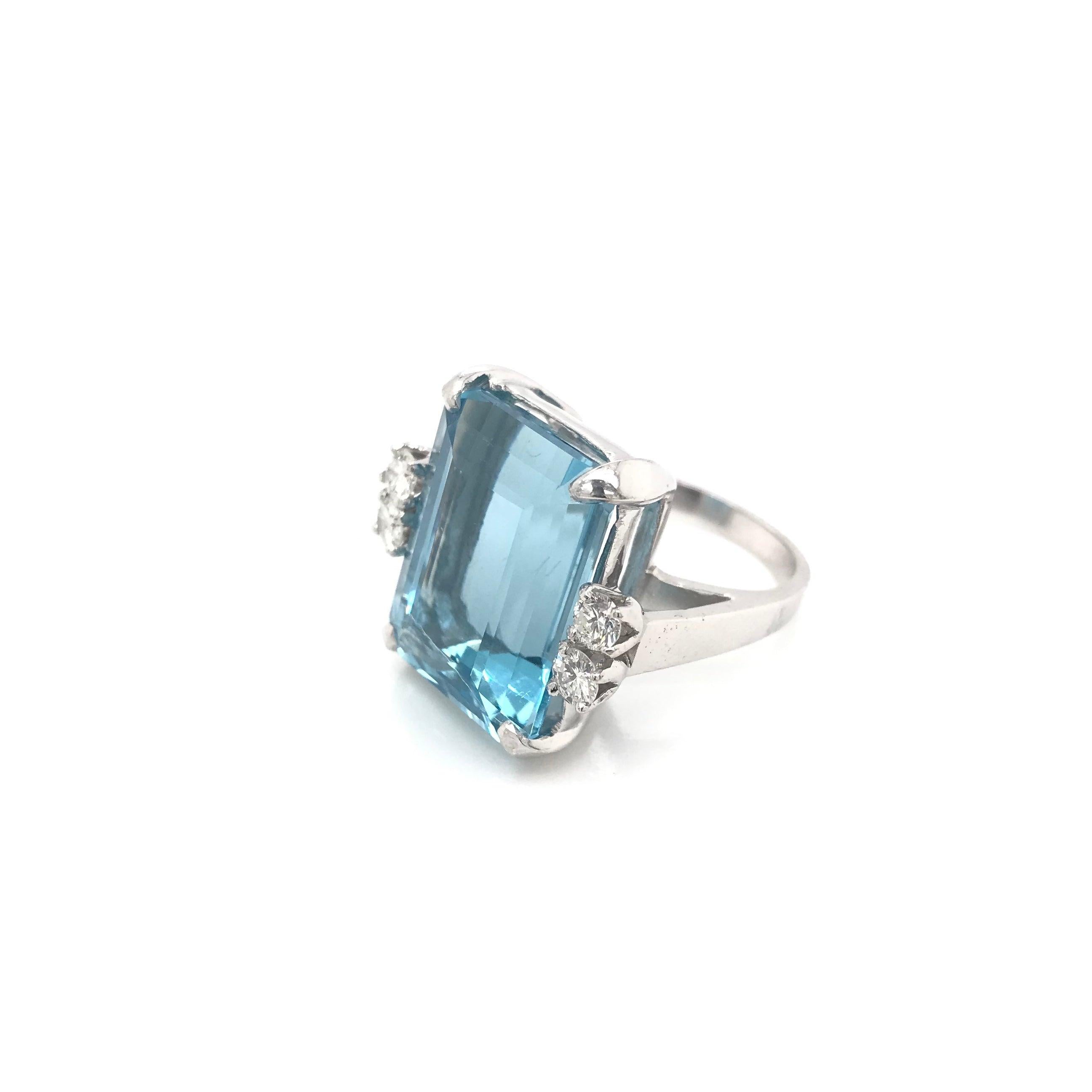 This vintage piece was crafted sometime during the Retro design period (1940-1960). The white gold setting features a large and very beautifully saturated Santa Maria Aquamarine. This stone has been certified by the Gemological Institute of America.