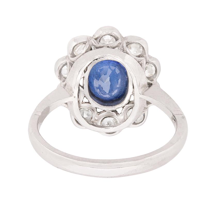 Oval Cut Vintage Mid-Century Sapphire and Diamond Halo Ring, circa 1950s
