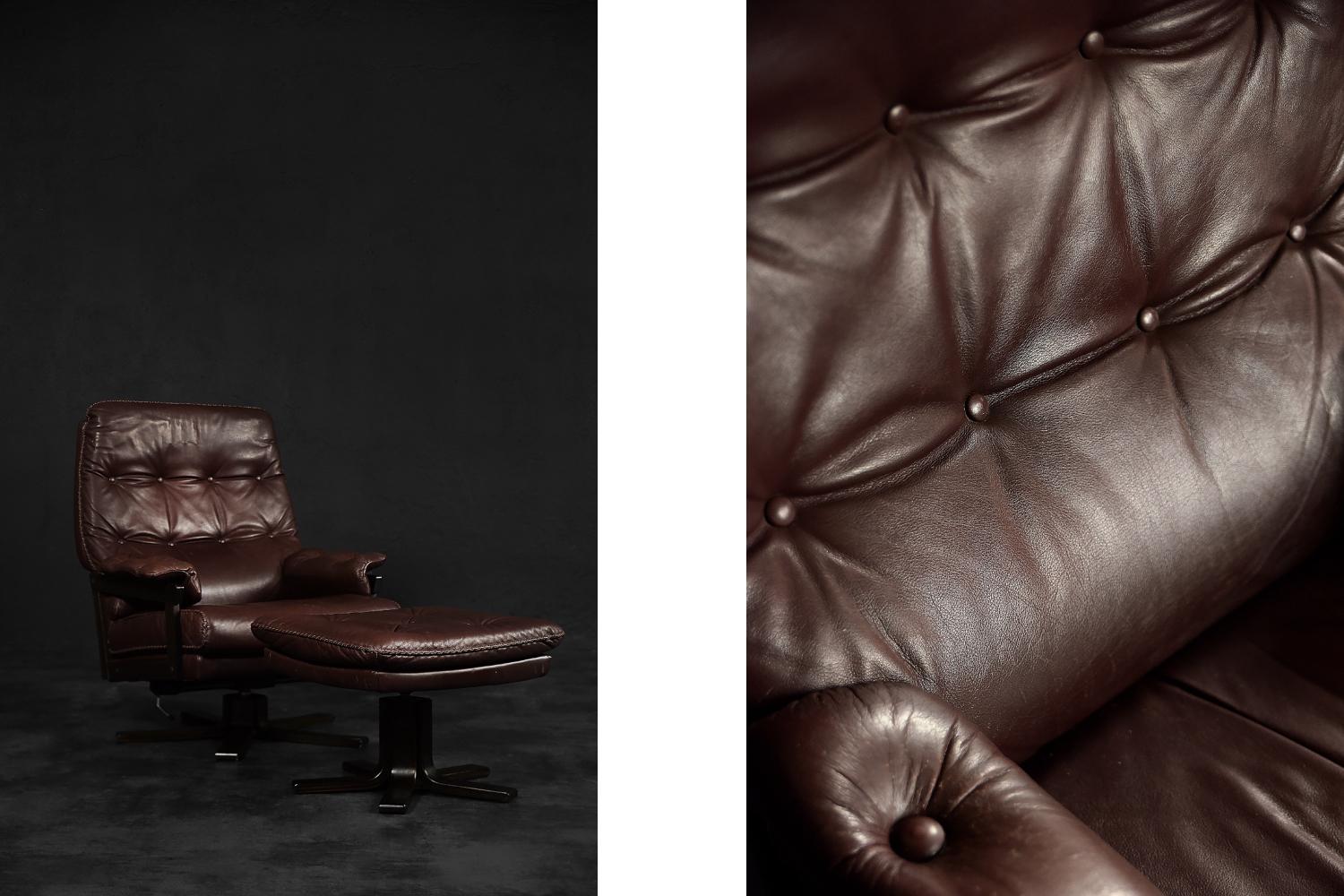 This modernist armchair with a square-shaped ottoman was made in Denmark during the 1970s. The frame of the armchair is made of wood. The set is upholstered in high-quality soft natural leather in brown colour. Both items have a wooden and rotating