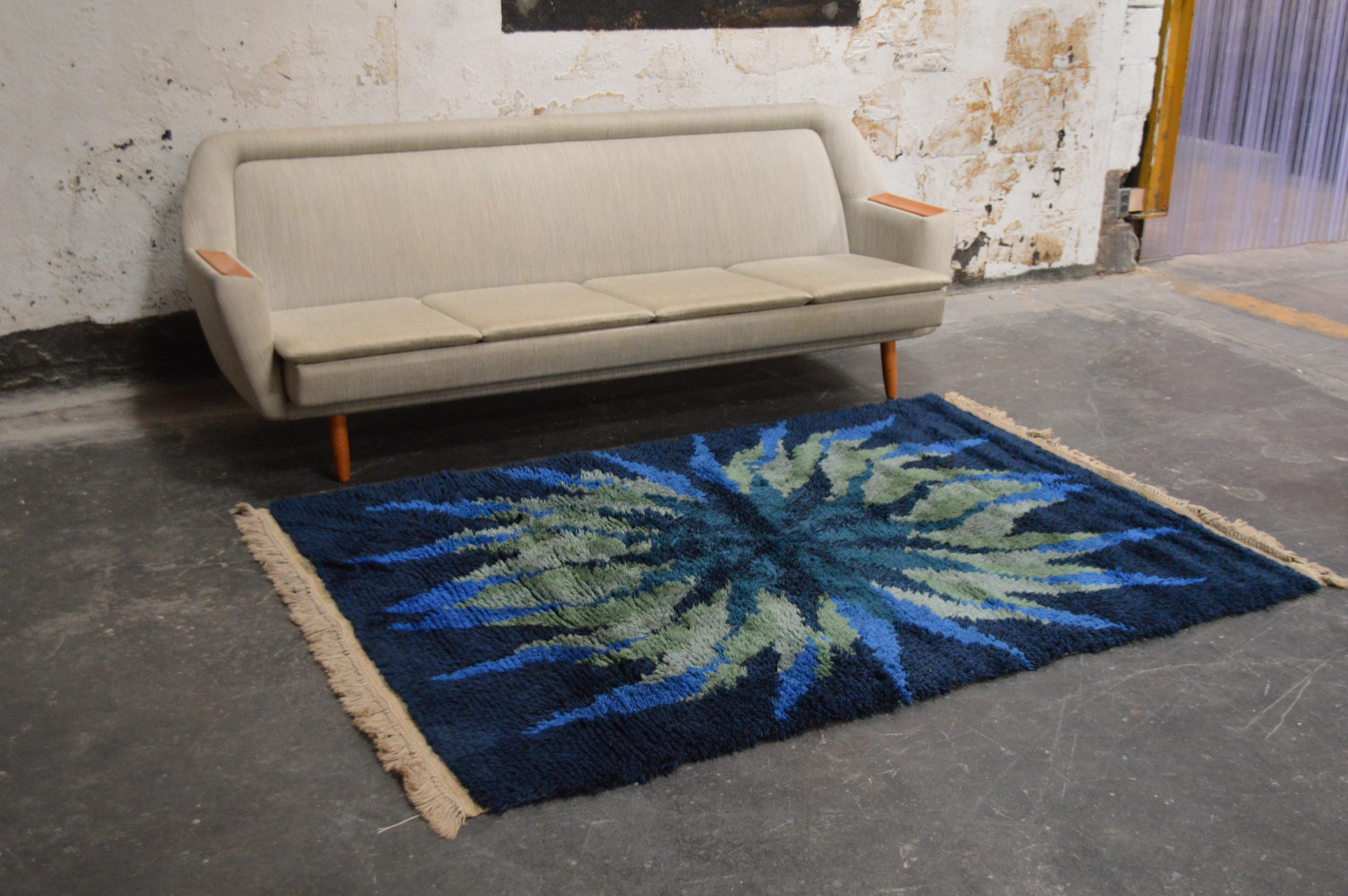 Vintage Scandinavian Rya rug with a unique and intriguing vintage design - a vintage Rya rug that was woven in Scandinavia during the 1960s. Boasting a fascinating color pallet and a compelling design, this rug is bold yet versatile and will flow