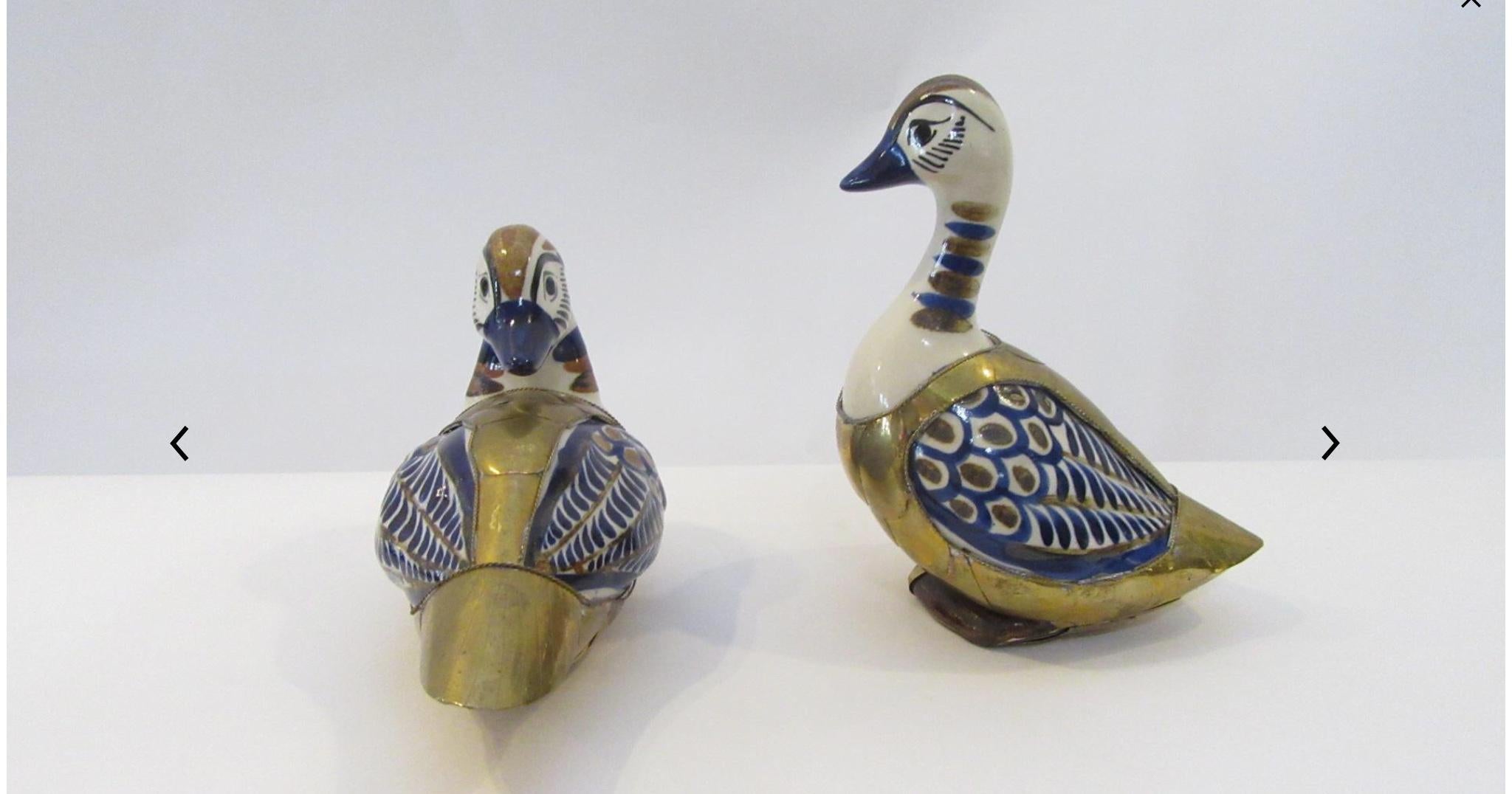 Excellent accent pieces by renowned Mexican Artist Sergio Bustamante.
Short duck dimensions: 8.5” L x 4.5” W x 5.5” H
Tall duck dimensions: 6.5” L x 4” W x 7.75” H.