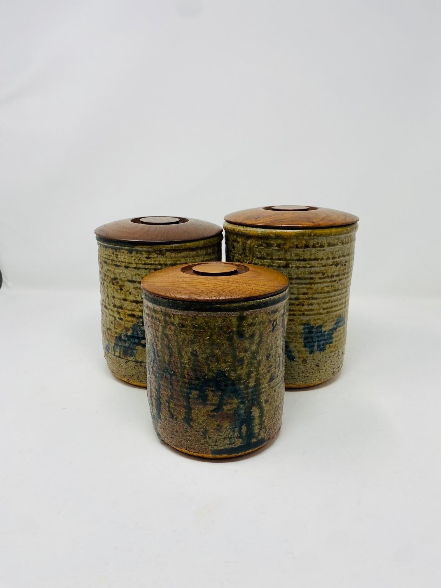 American Vintage Mid-Century Set of 3 Ceramic Canisters with Wooden Lids Studio Pottery For Sale