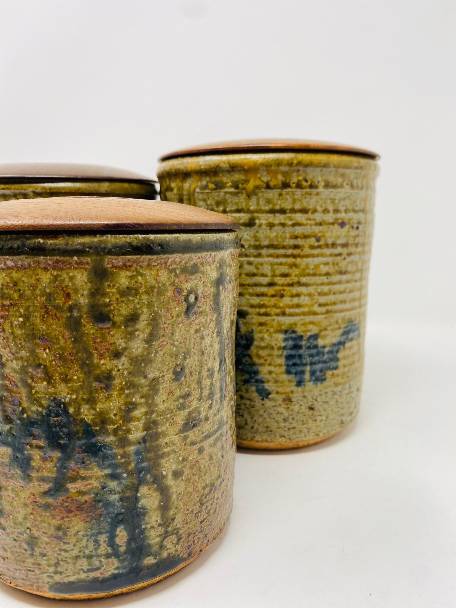 Glazed Vintage Mid-Century Set of 3 Ceramic Canisters with Wooden Lids Studio Pottery For Sale