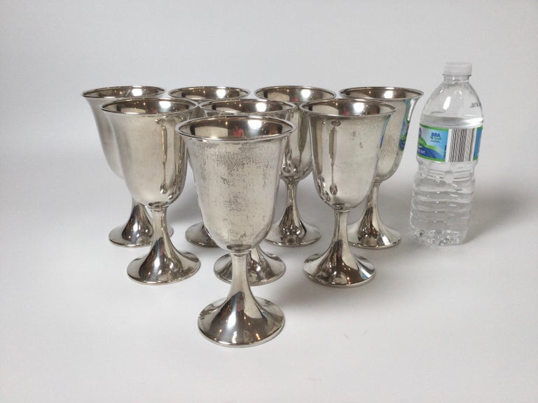 Vintage mid-century set of eight sterling silver wine- water goblets. Perfect for adding that rich look at your special dinner party! Goblets are marked sterling on underside of base.
Dimensions: 6.75