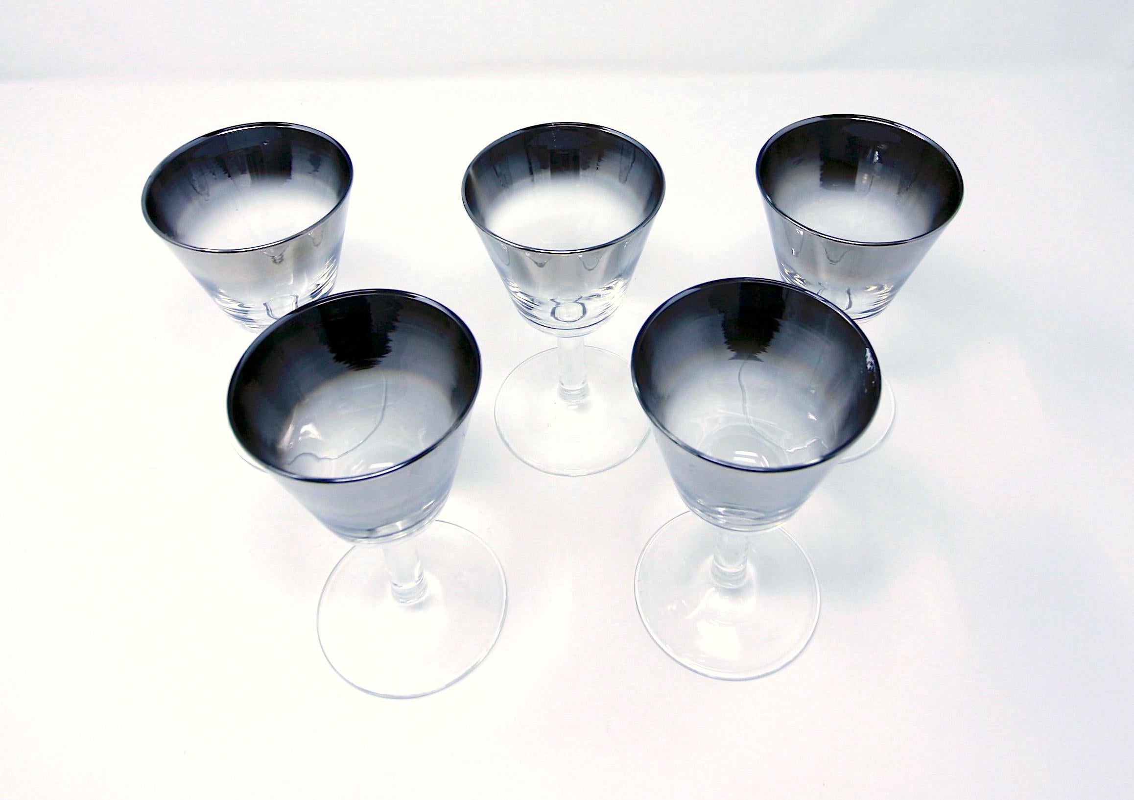 Set of 5 MCM silver fade aperitif or cordial glasses, perfect for sherry or any after-dinner drink. Great for your bar -- or even to just drink orange juice from! 

Very good vintage condition. The finish is scratched on one glass and the foot is