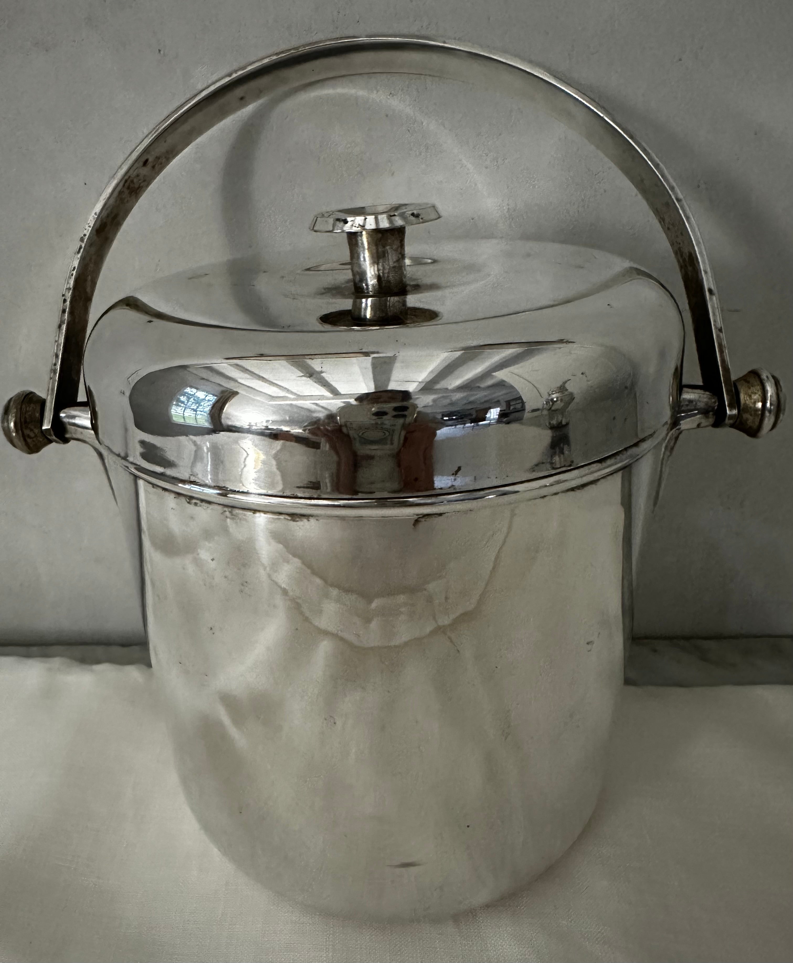 Vintage Mid Century Silver Plate Ice Bucket. In good vintage condition with some minor blemishes.  
6