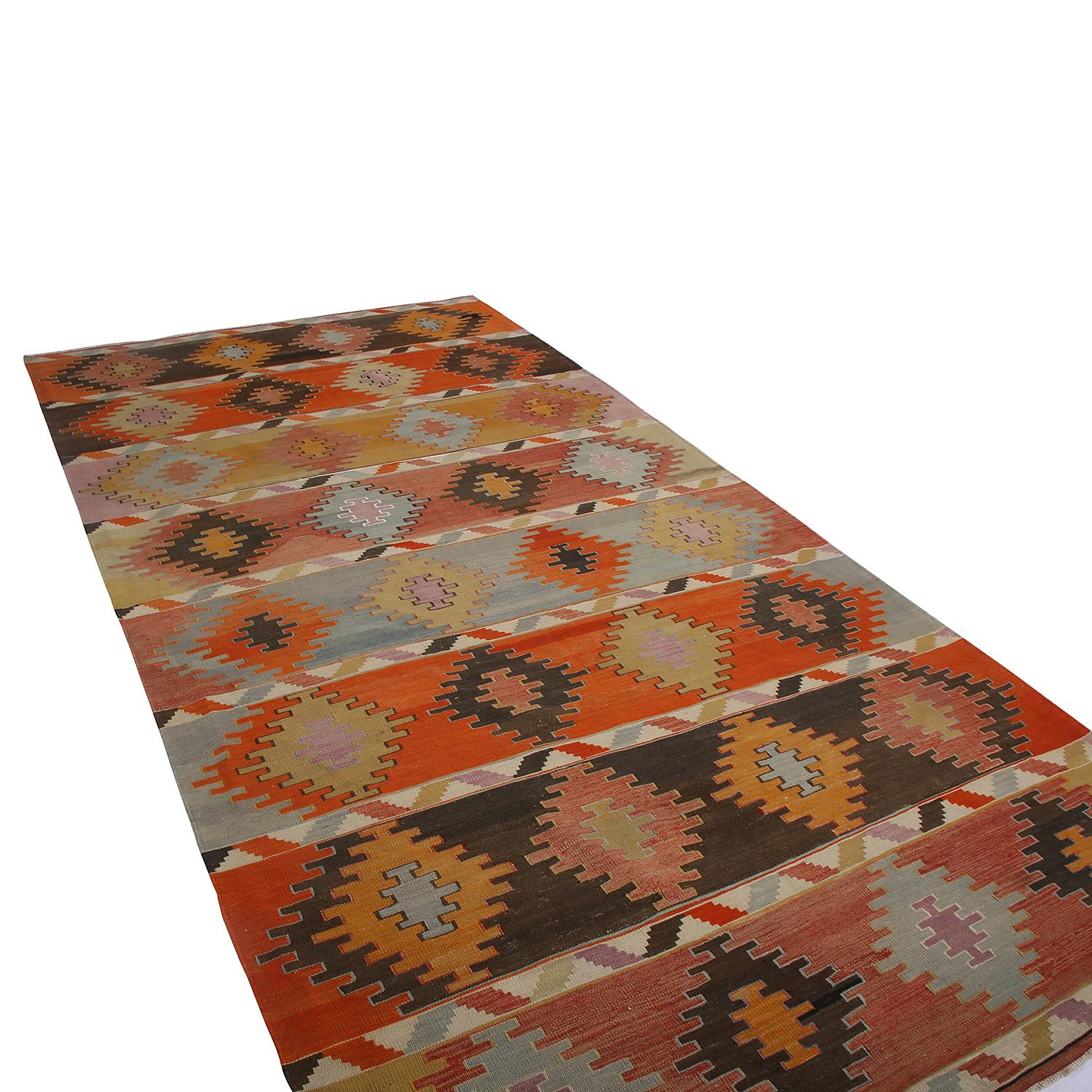 Handwoven in Turkey originating between 1950-1960, this vintage midcentury 6 x 11 wool Kilim hails from the Sivas province, a widely regarded locale of acclaimed Central Anatolian rarities. The lack of exact repetition in the rows of bright and