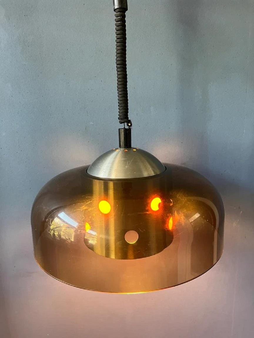 Very rare mid century pendant lamp in space age style by Herda. The lamp has an acrylic outer shade and an aluminium inner shade. The lamp requires one E27 lightbulb.

Dimensions:
ø: 39 cm
Height (shade): 25

Condition: Very good. The lamp is in