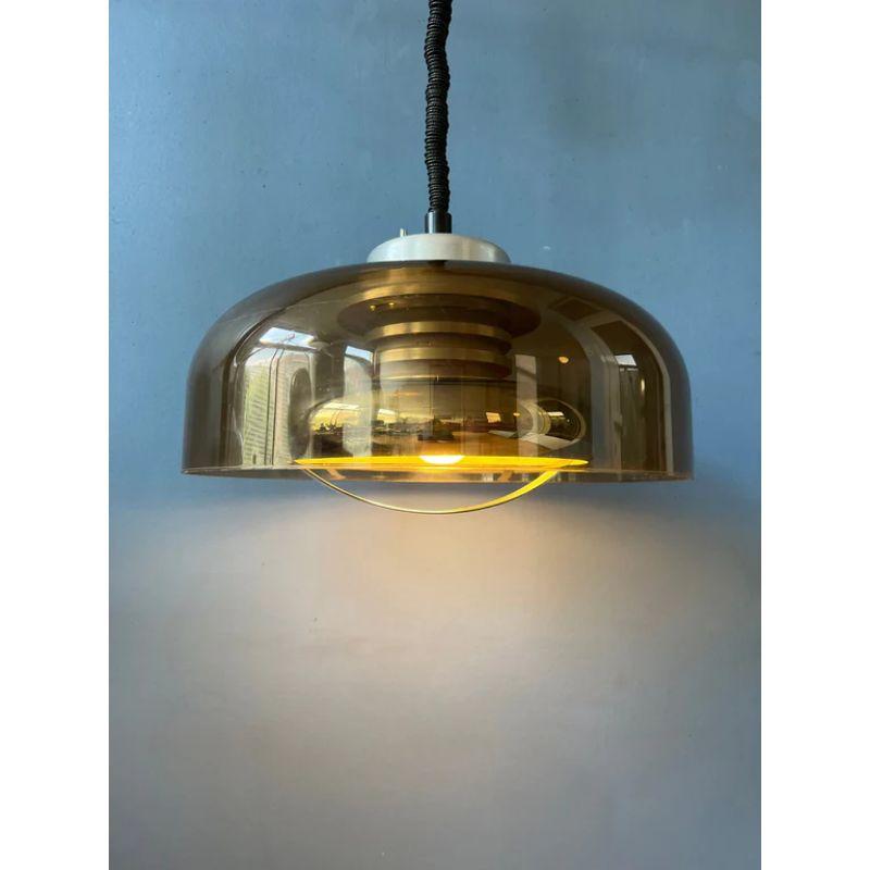 Beautiful space age pendant by the Dutch brand Herda (two available). The lamp has an acrylic outer shade and an aluminium inner shade. The lamp requires one E27 lightbulb.

[Dimensions]
ø: 39 cm
Height (shade): 25

Condition: Very good. The