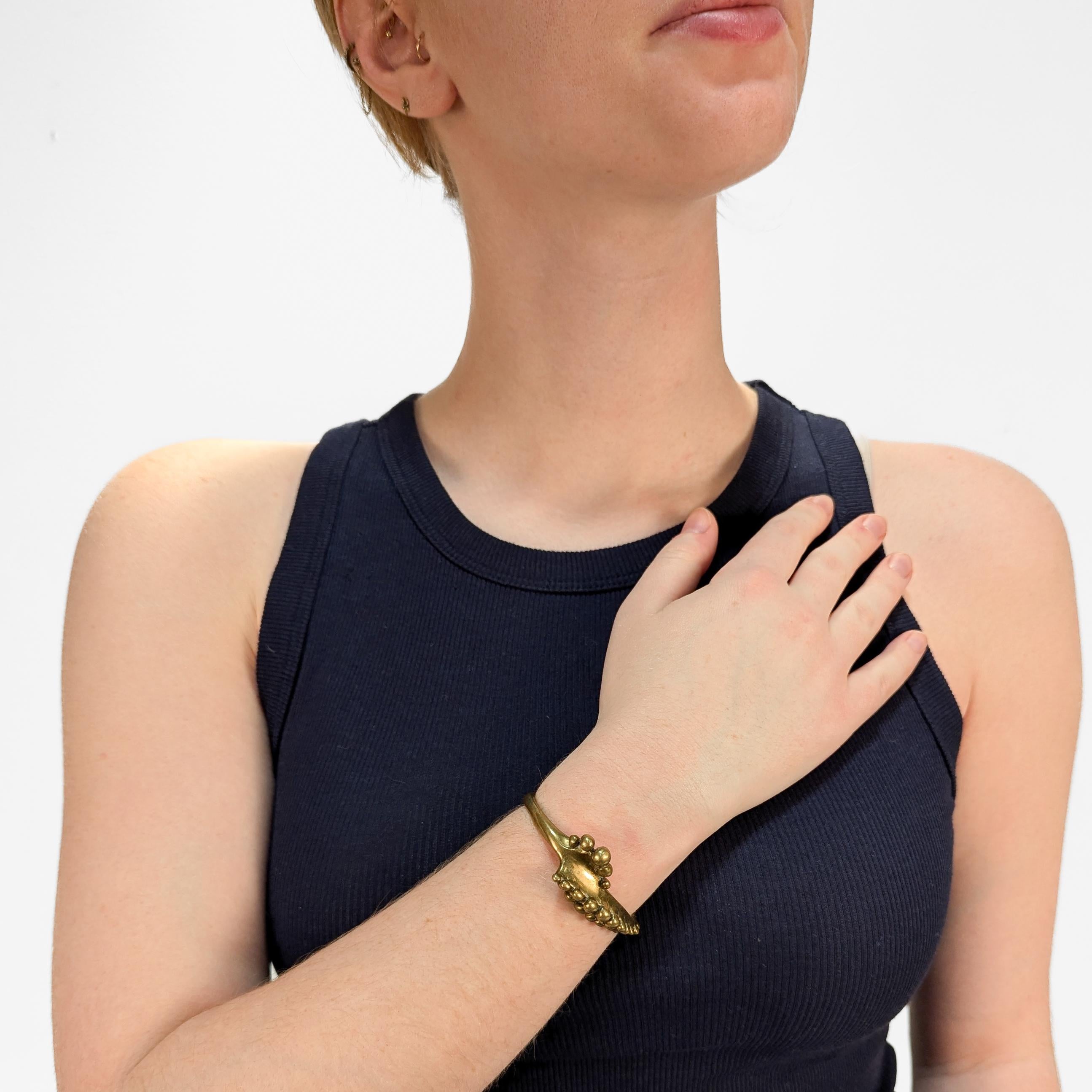 A fine Brutalist cuff bracelet.

In cast brass. 

Attributed to Stephen Burr.

Simply a wonderful Modernist bracelet!

Date:
20th Century

Overall Condition:
It is in overall good, as-pictured, used estate condition.

Condition Details:
There is