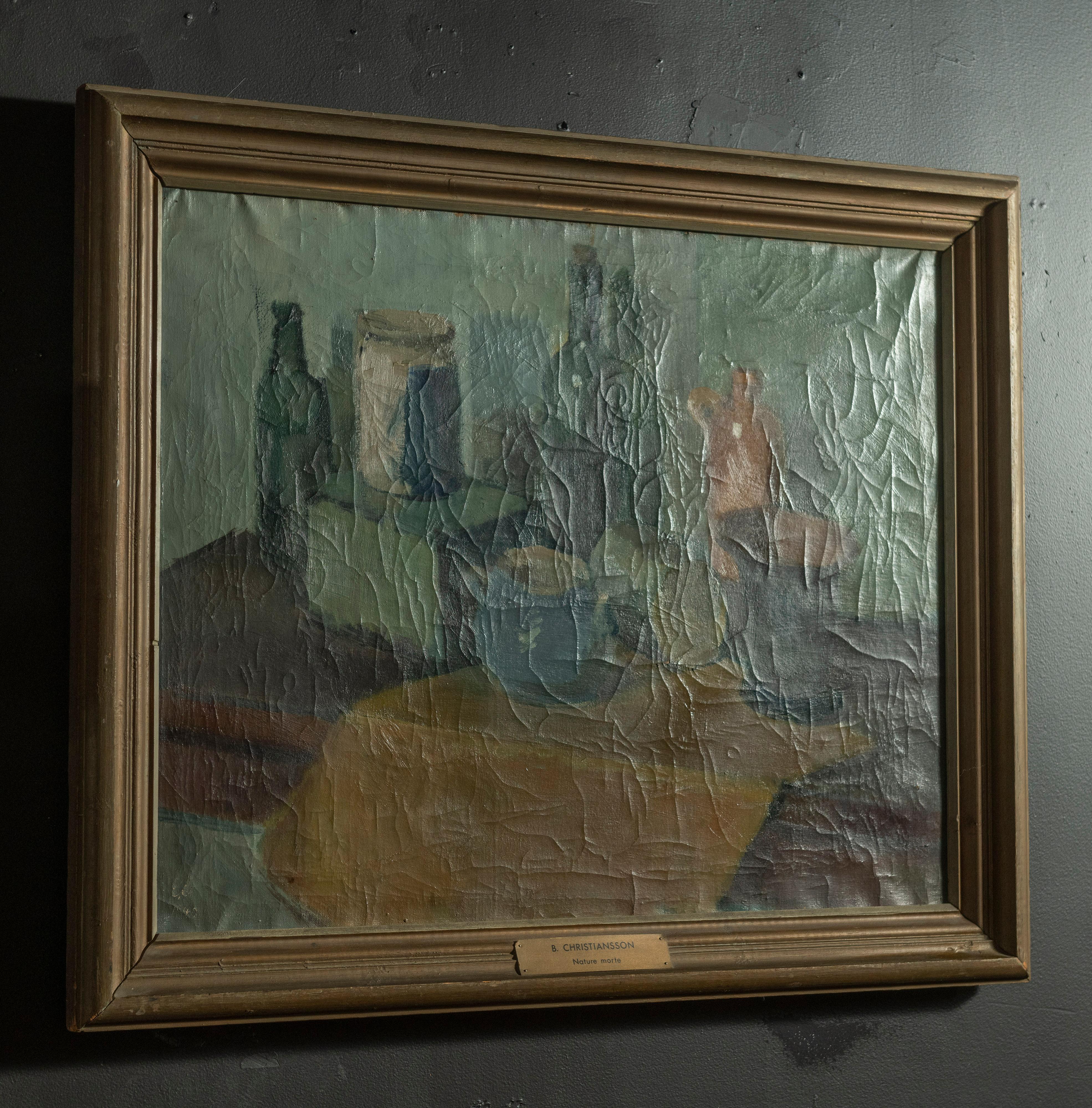 This quiet vintage midcentury still life oil painting is framed and signed by B. Christiansson, well known Swedish artist. In muted shades of mostly green and blue, the artist features various vessels on a table. The canvas has a lovely patina and