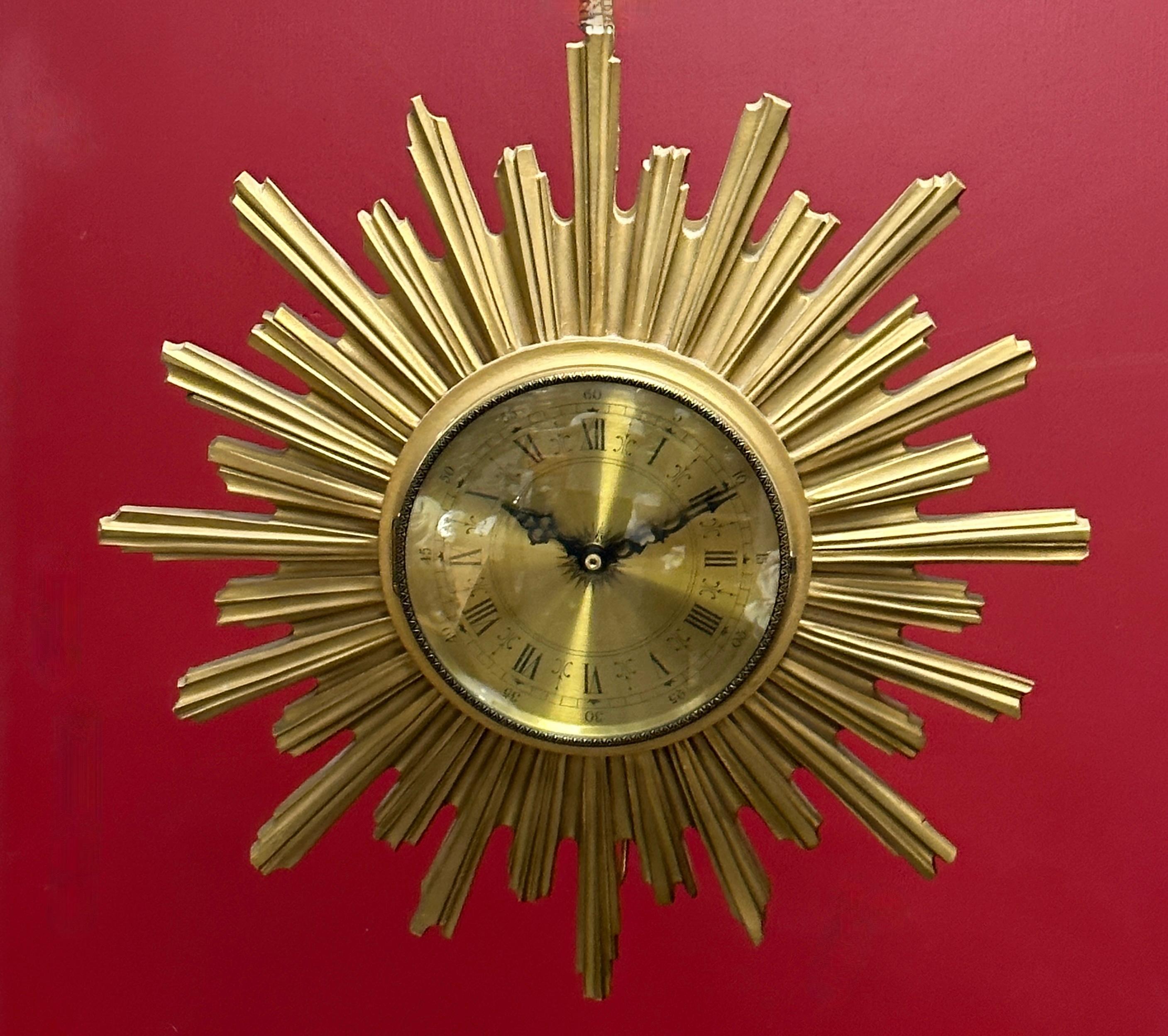 Stunning 1970s sunburst starburst Junghans wall clock. Made of heavy resin, gilded, with a junghans battery operated clockwork. working condition. Will look great on your wall. Nice working condition. Clock face itself is approx. 6.75 inches in