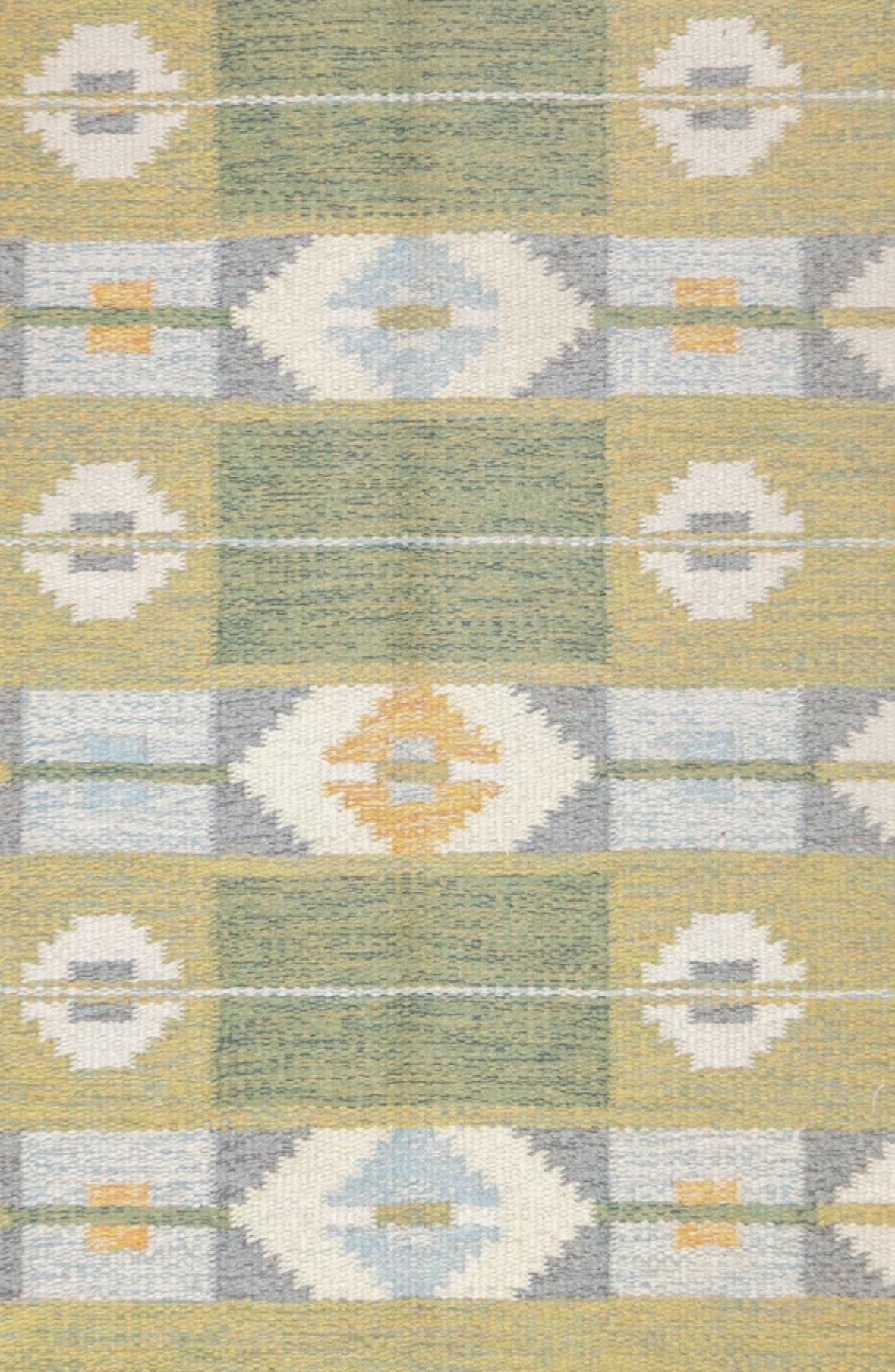 This is a lovely handwoven Ingegerd Silow Vintage Mid-Century Swedish Rollaken Kilim measuring 4.6 x 5.7 ft. Signed IS.