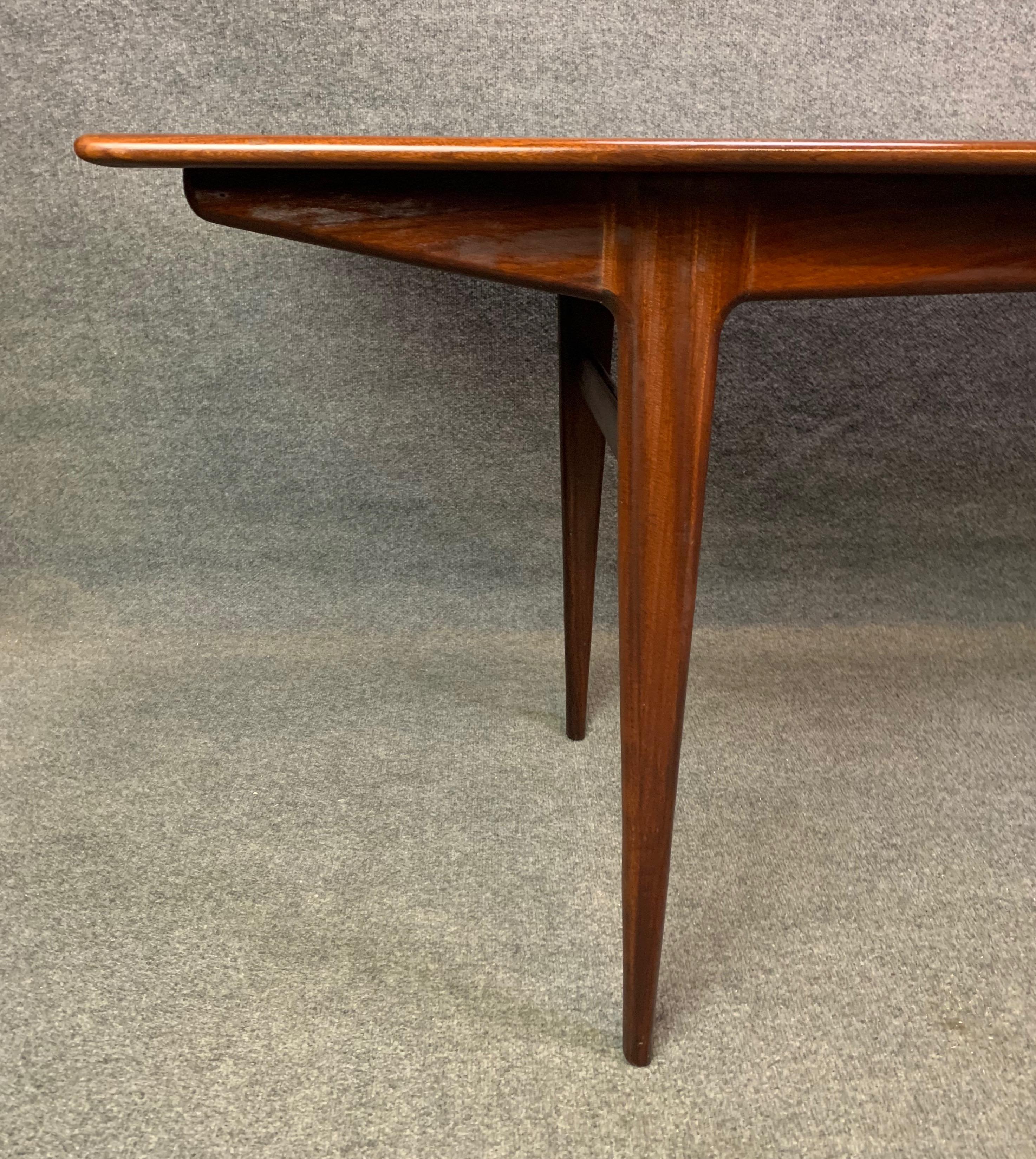 Here is a beautiful british Mid-Century Modern solid African teak dining table attributed to designer Richard Hornby and manufacturer Fyne Ladye, UK, 1960s.
This long table, recently imported from England to California before its refinishing,