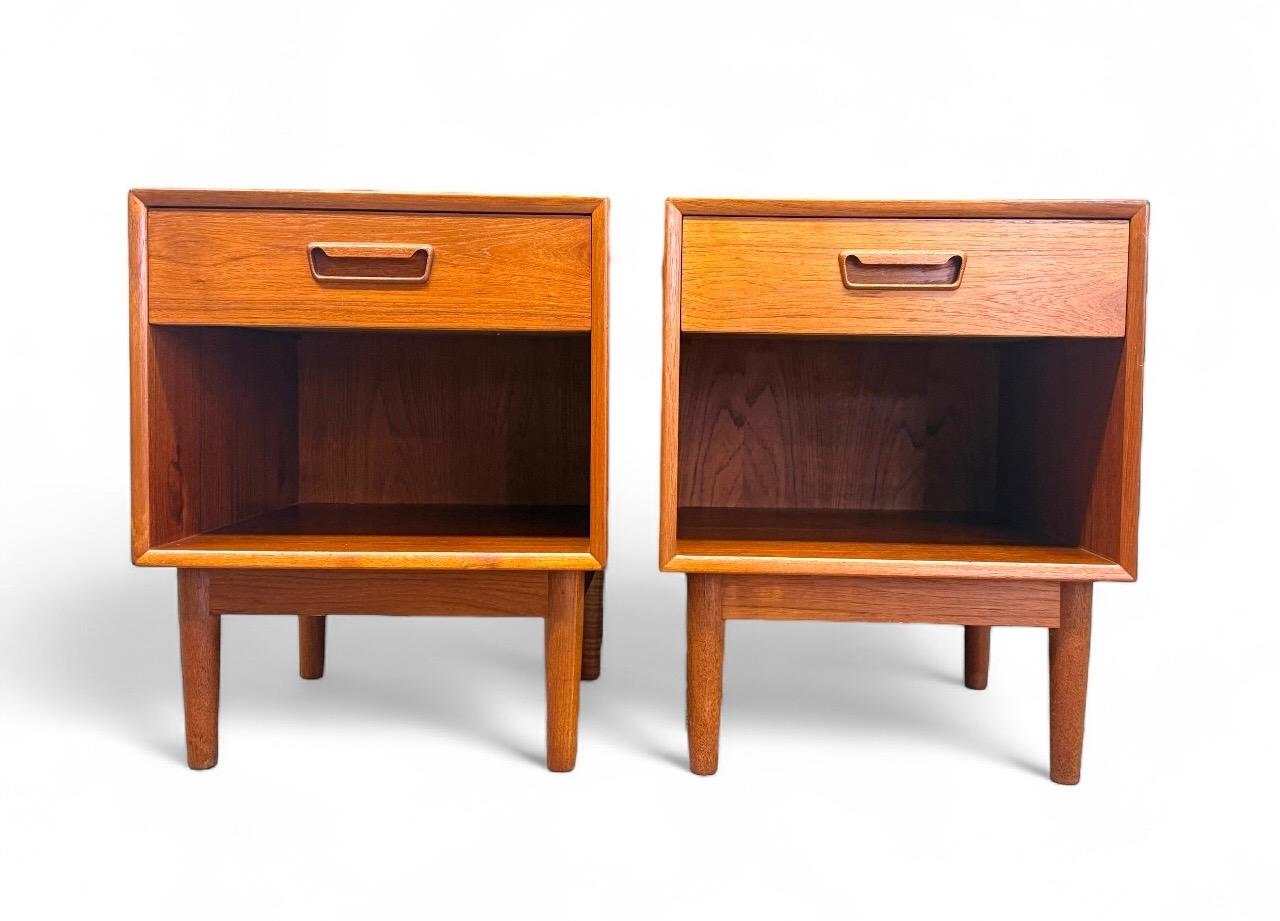  This restored pair of mid-century modern teak nightstands by Westnofa beautifully embodies classic Scandinavian design and craftsmanship. Made in Norway, each piece features clean lines, warm teak wood grain, a dovetail-joined drawer with a