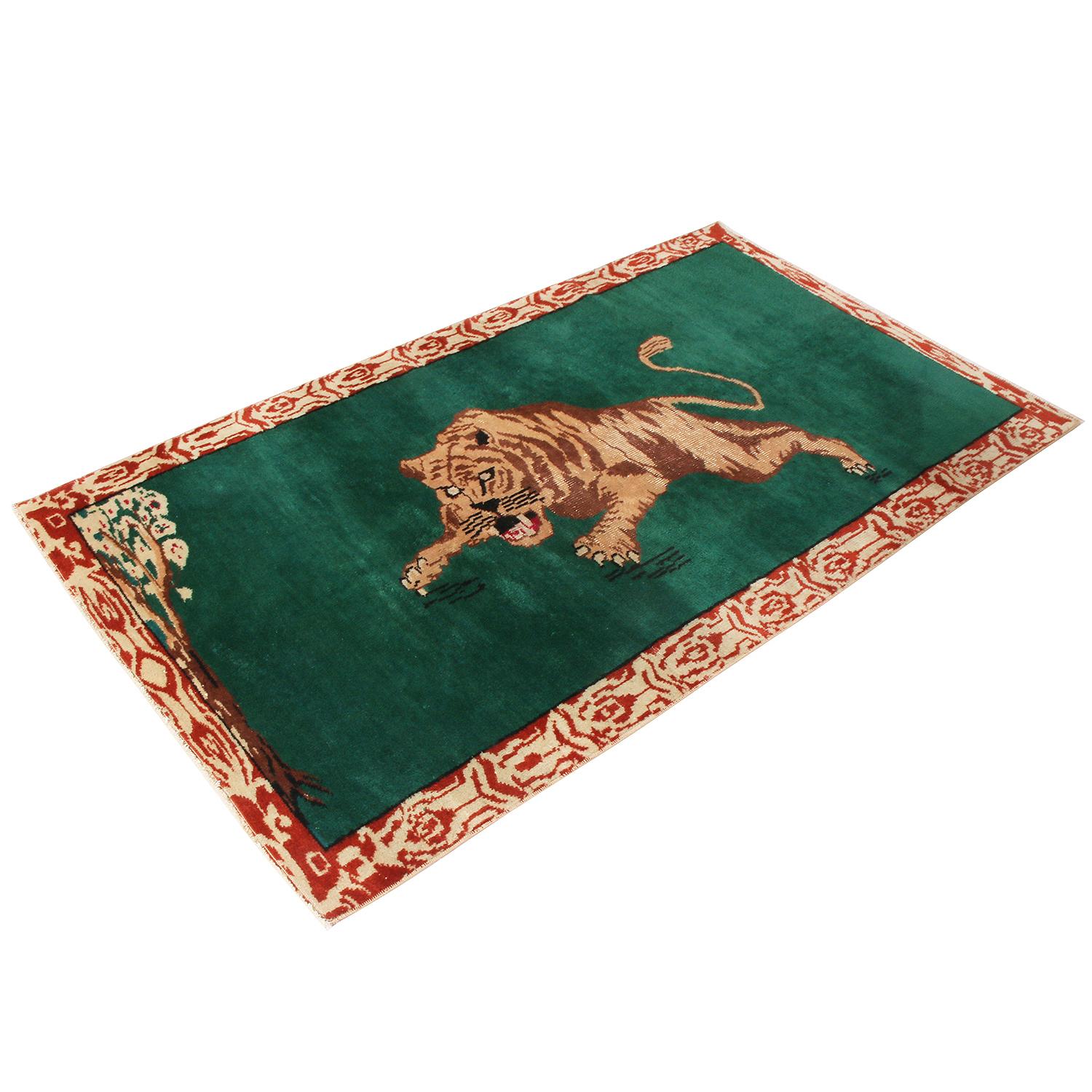Hand knotted in Turkey originating between 1950-1960, this vintage midcentury wool rug enjoys one of the more uncommon, dimensionally arresting variations of a pictorial Tiger motif with a warm palette of beige-brown earth tones set against an