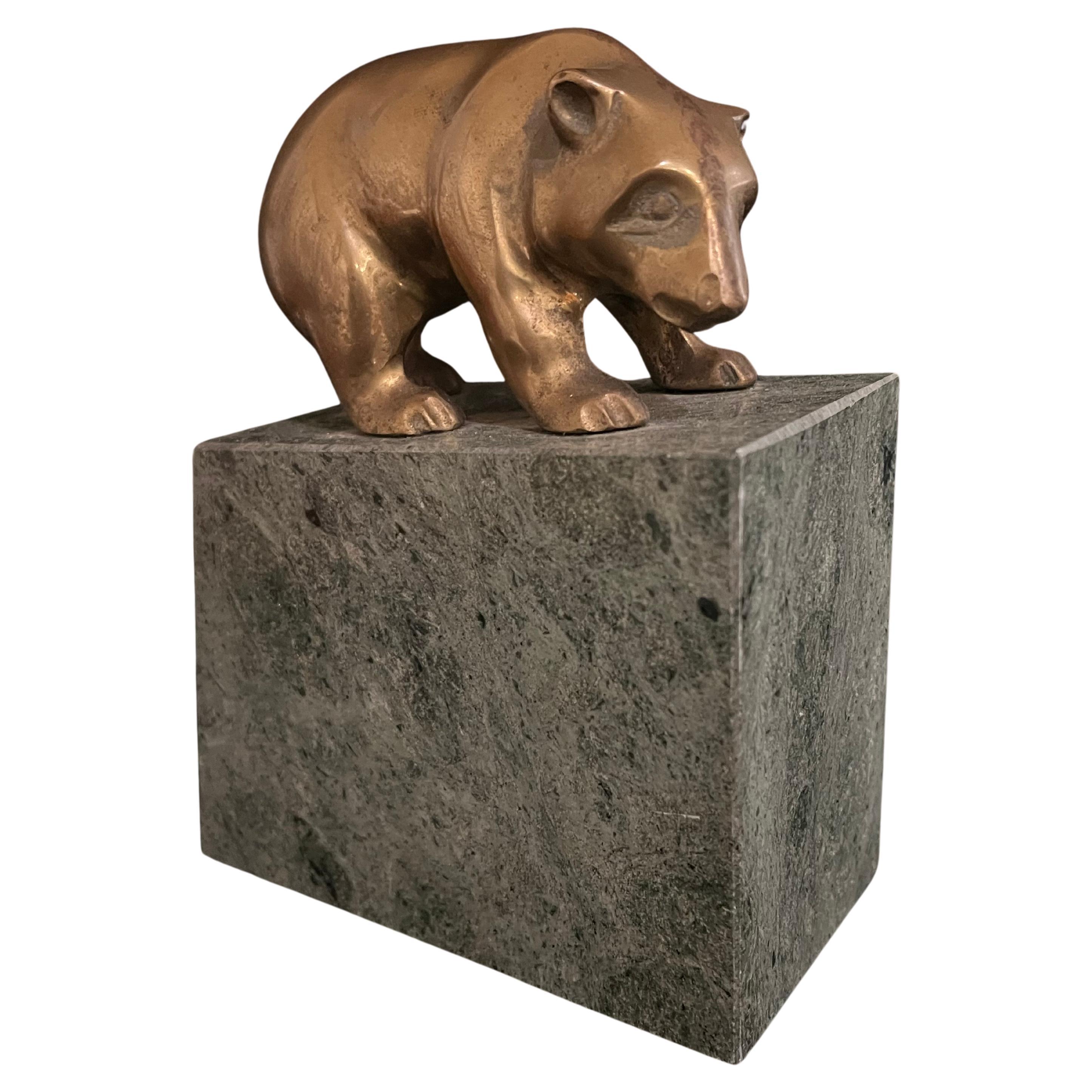 Mid-Century Modern stock market bookend sculpture brass bear on a solid marble base. These iconic symbols of Wall Street presented majestically on a marble base that adds a solid (literally) essence of style. Unique and full of style. Great addition