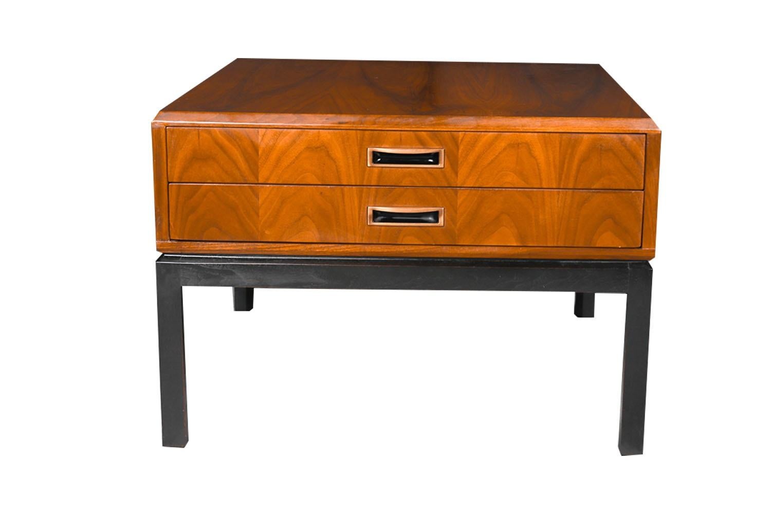 An exceptional Campaign style Mid-Century Modern, large side/ end table in the style of Jack Cartwright for Founders, circa 19th century. This absolute jewel remains in nearly pristine condition. The lines are clean and elegant. Features rich warm