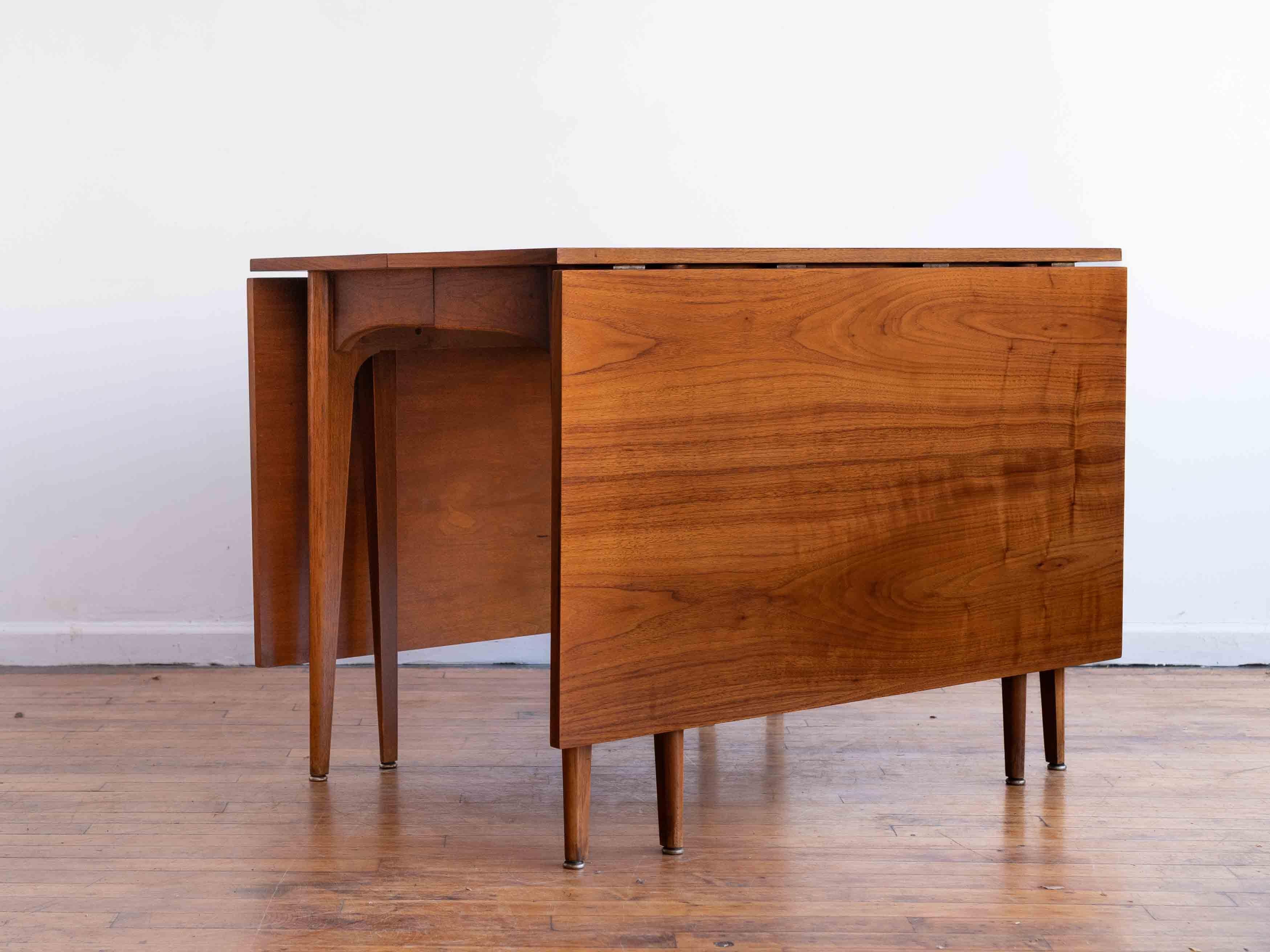 Gorgeous mid-century walnut drop leaf table that extends from 29