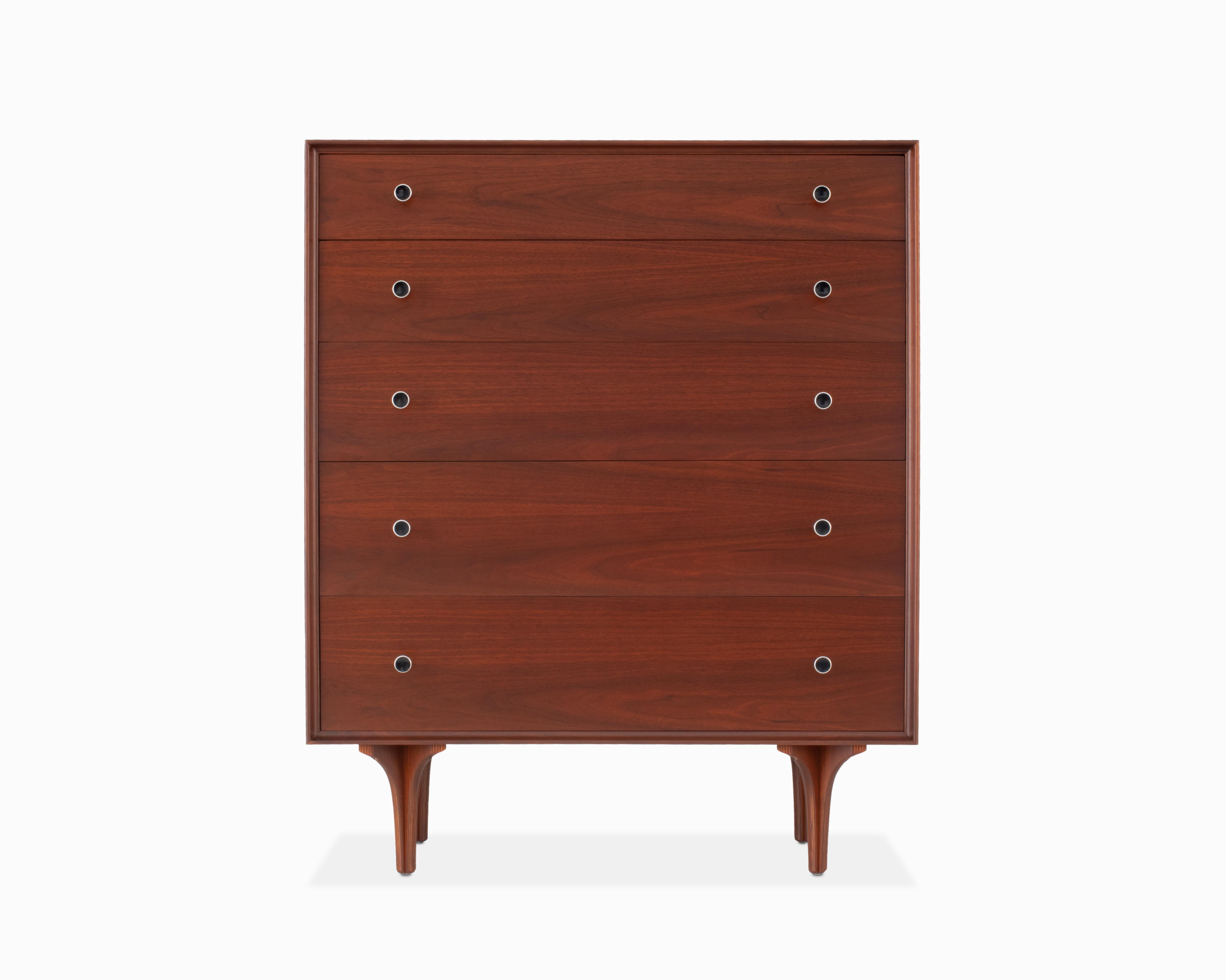 Here is a lovely and uncommon walnut dresser designed by Robert Baron for Glenn of California. It is in beautiful refinished condition, featuring 5 large drawers, hourglass aluminum pulls with enamel detail and uniquely sculptural plywood legs. We