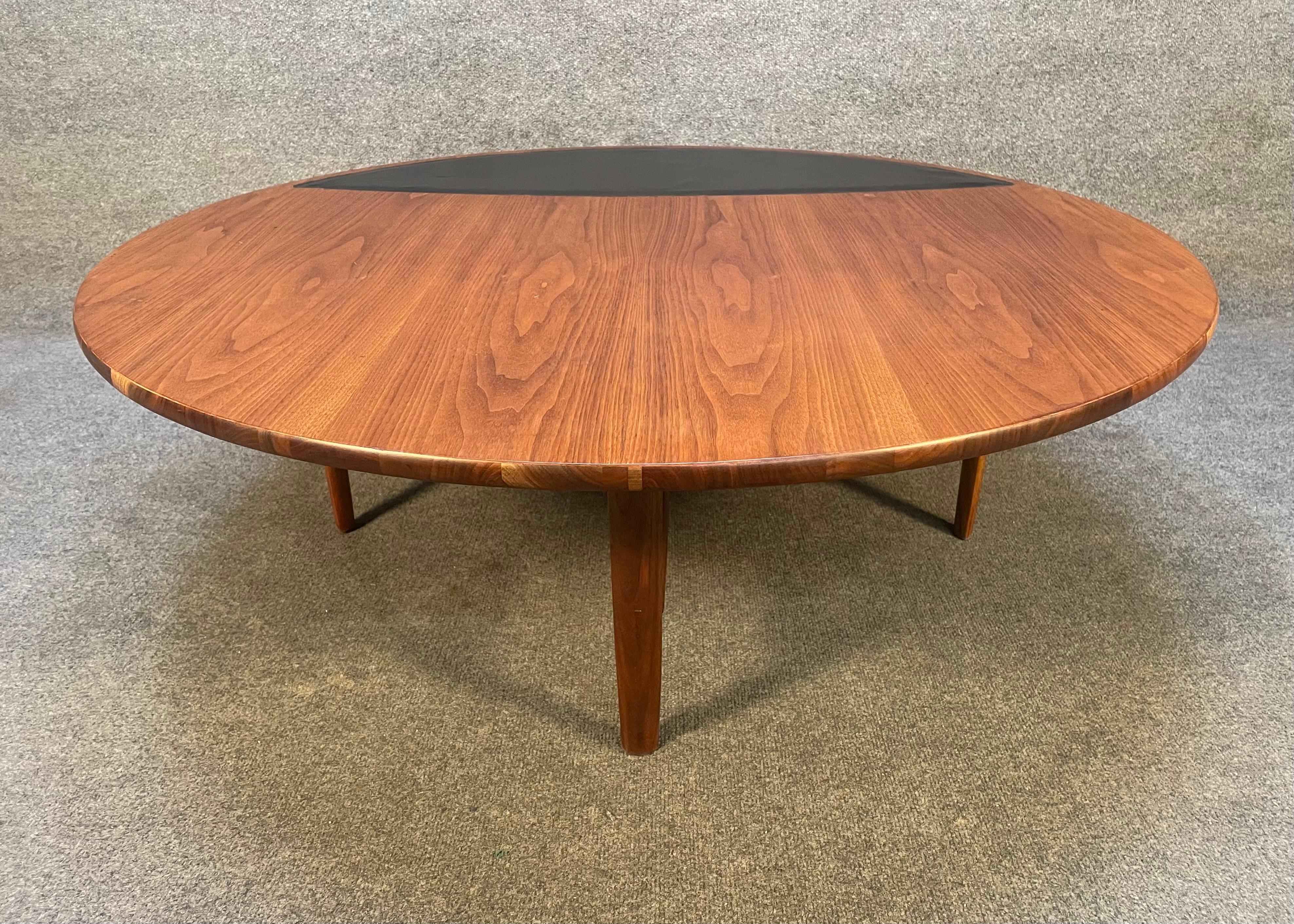 Here is a beautiful Mid-Century Modern coffee table in walnut from the 