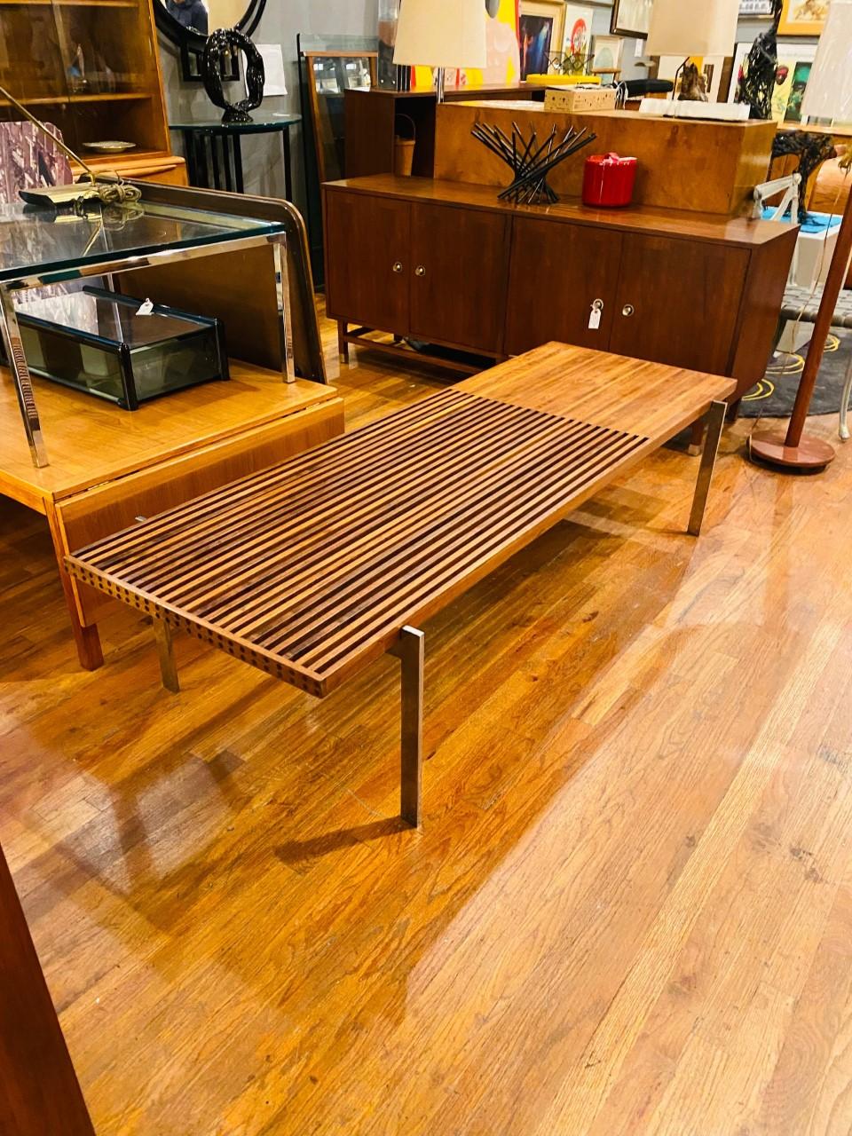 Beautiful Walnut Vintage Mid Century Slat Bench and Coffee table. This beautiful vintage piece is iconic mid-century as it is current.  The minimal lines are superb, drawing your eye to its beautiful form with function.  The top consists of a slat