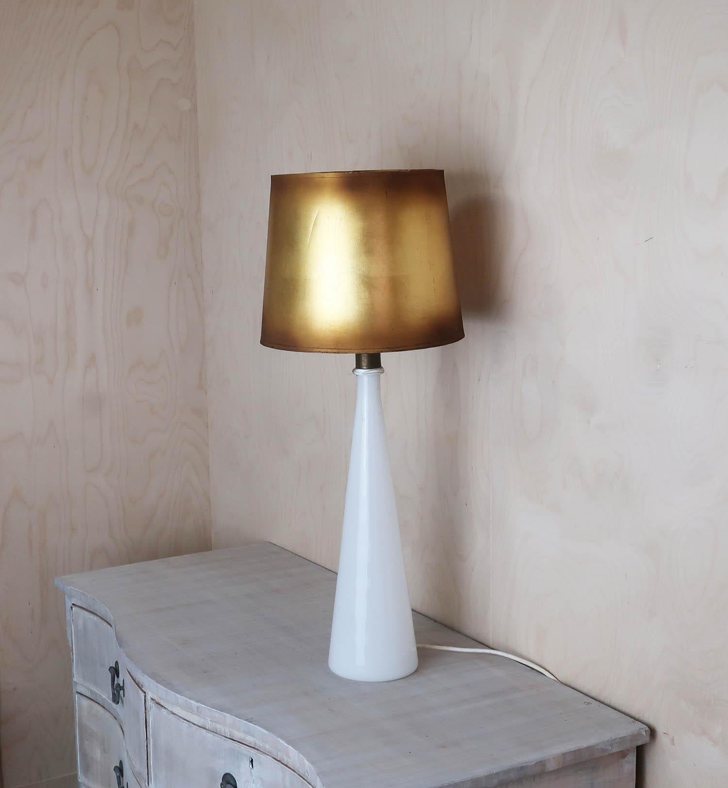 
Wonderful Murano opaline white glass table lamp

Possibly designed by Paulo Venini

Original gold shade

Shade included

Replaced white plastic bulb holder. Wired to UK standards.

Free UK shipping

 
 