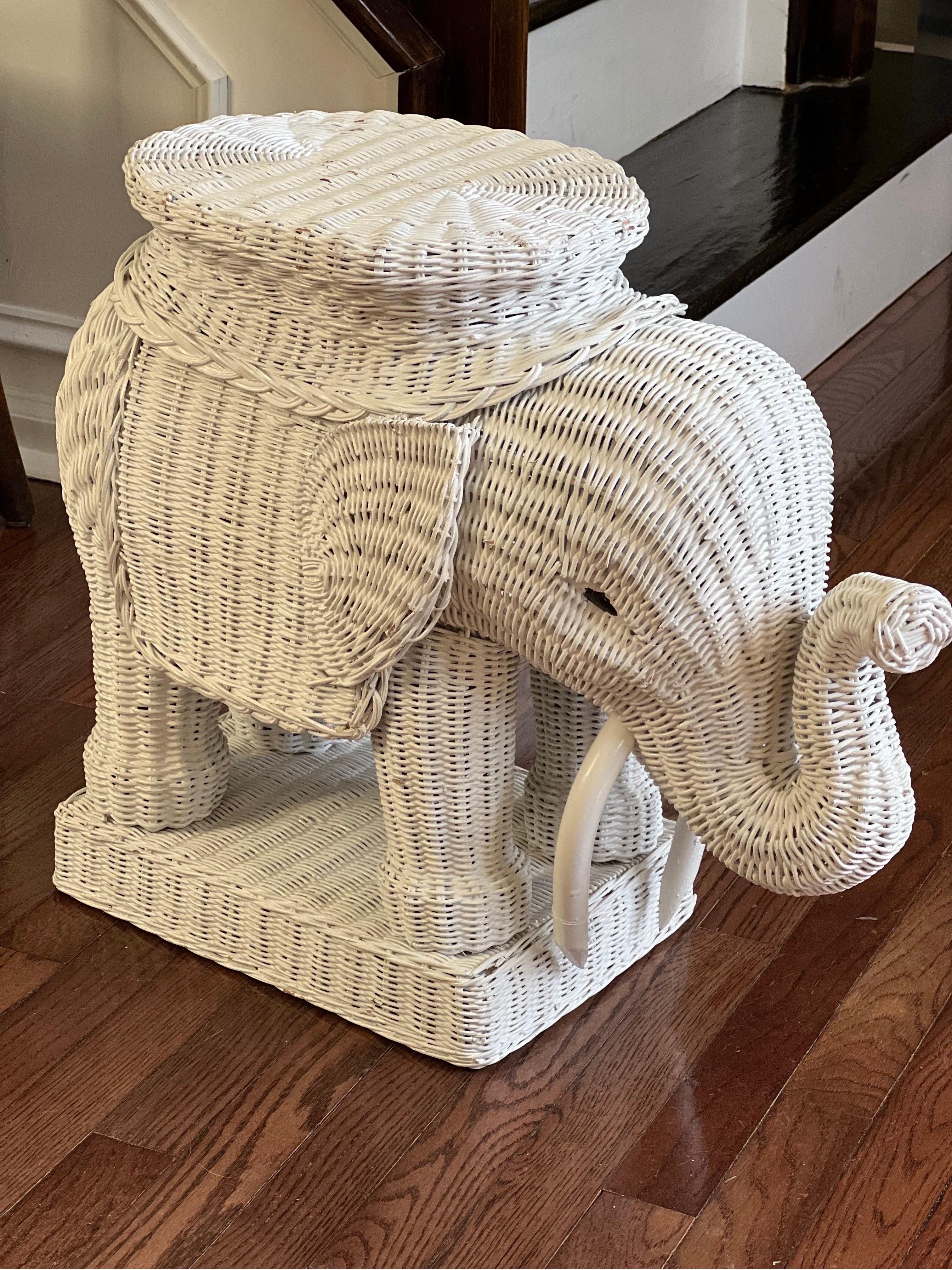Charming vintage wicker elephant taboret table with upward trunk. Symbolizing good luck, happiness and prosperity.