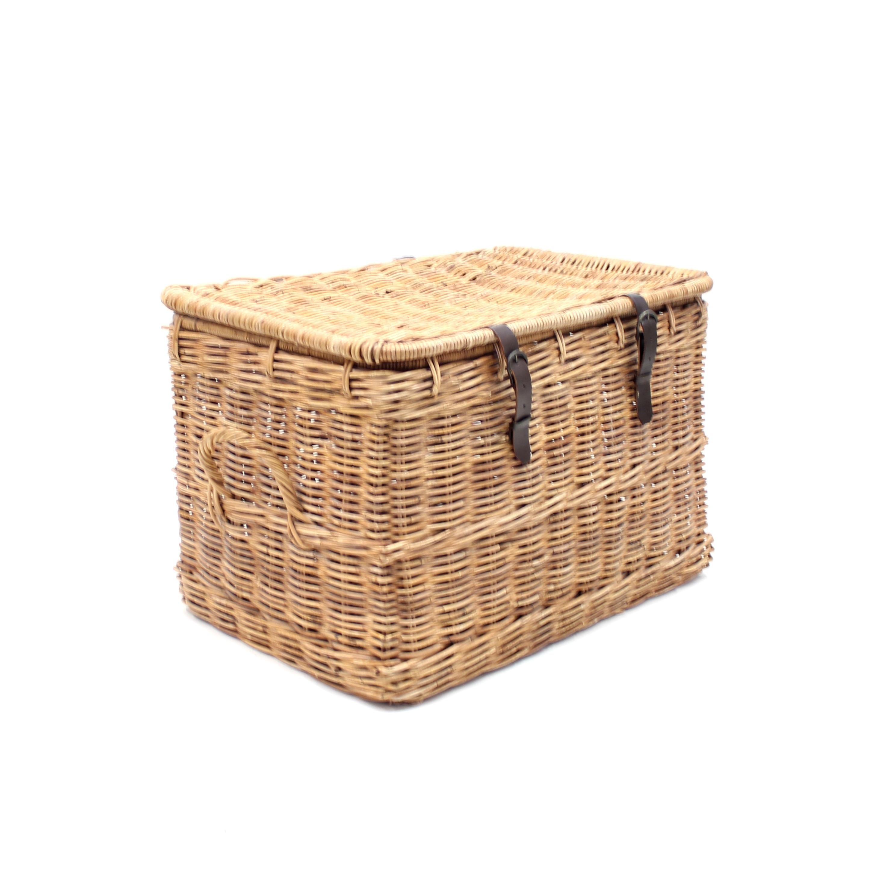Vintage wicker laundry basket with lid and leather straps. Overall very good vintage condition with light ware consistent with age and use. Leather straps may be a later addition.