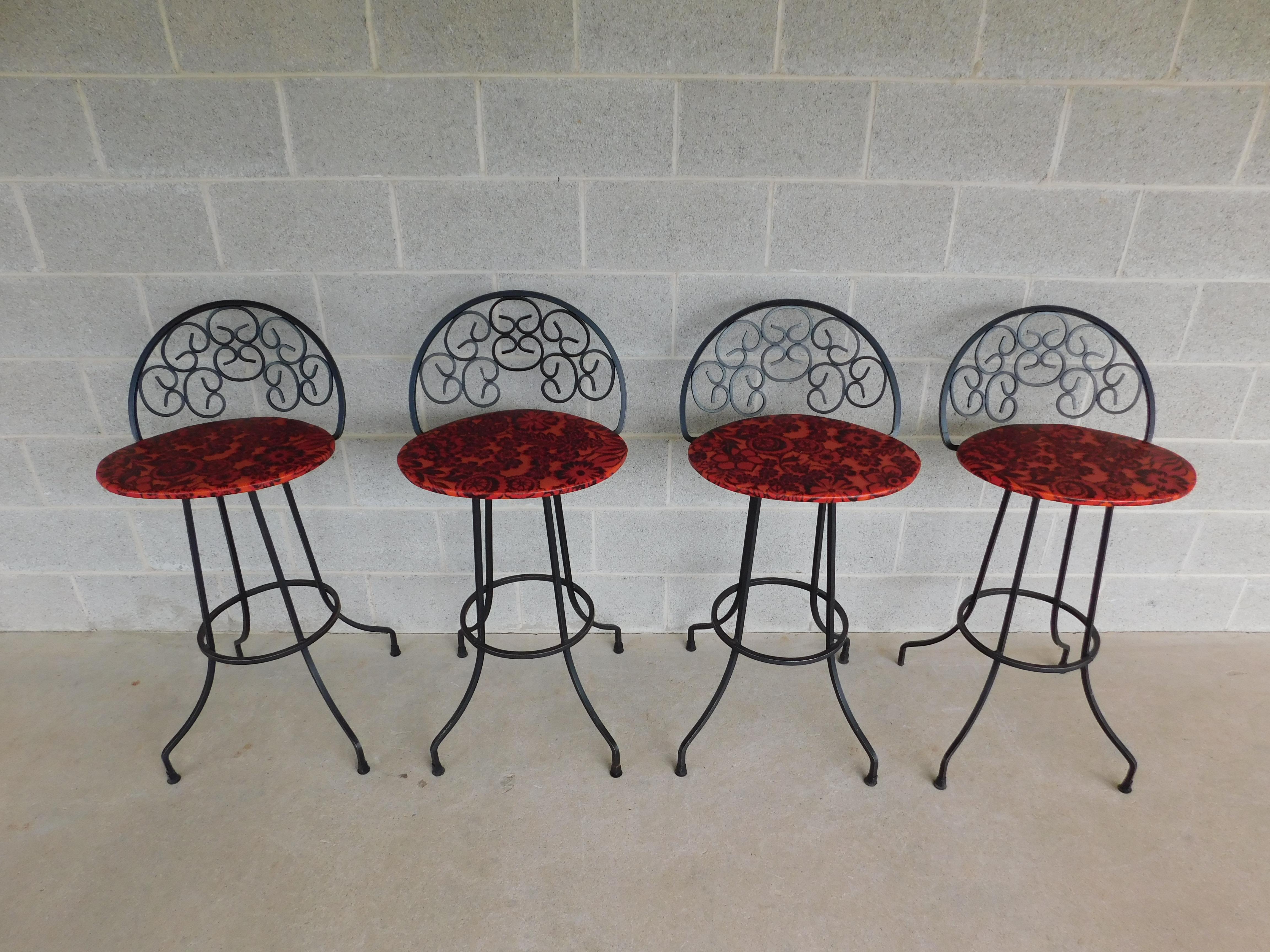 Vintage Mid-Century Wrought Iron Bar Stools Attributed to Authur Umanuff - Set of 4

360 Degree Full Swivel, Vinyl Fabric Seat Covering, welded construction.

Back Height 39