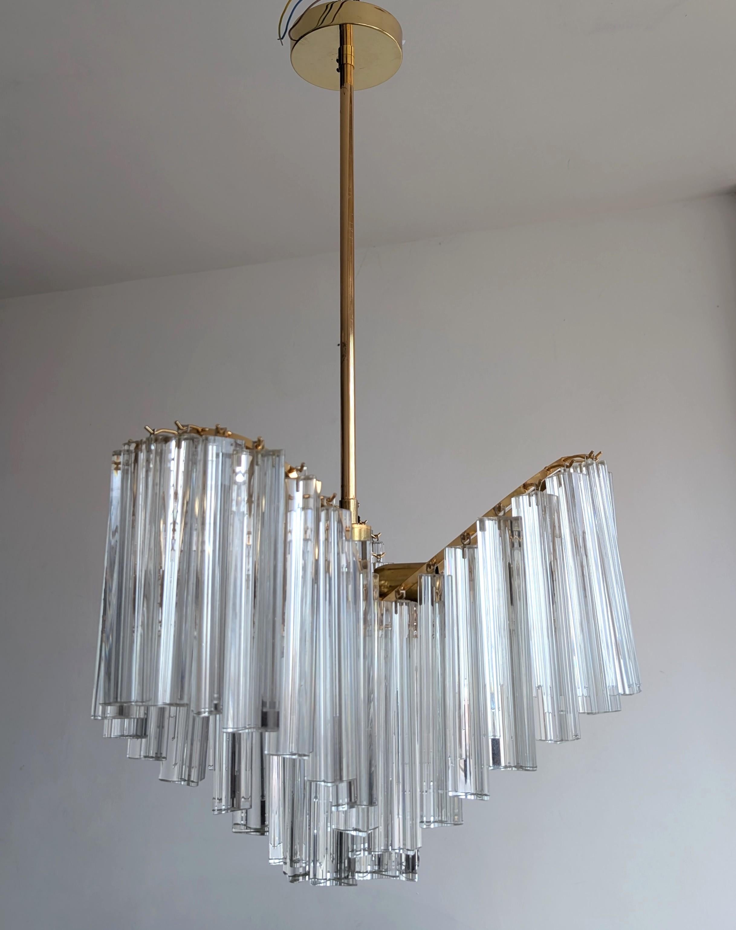 Vintage 1970s Venini style three-lobed chandelier. 20cm long triangle glass drops on gold-plated frame. One small crack in one of the drops, but it's totally hidden (see last photo, where I've moved a couple of other drops so you can see the crack