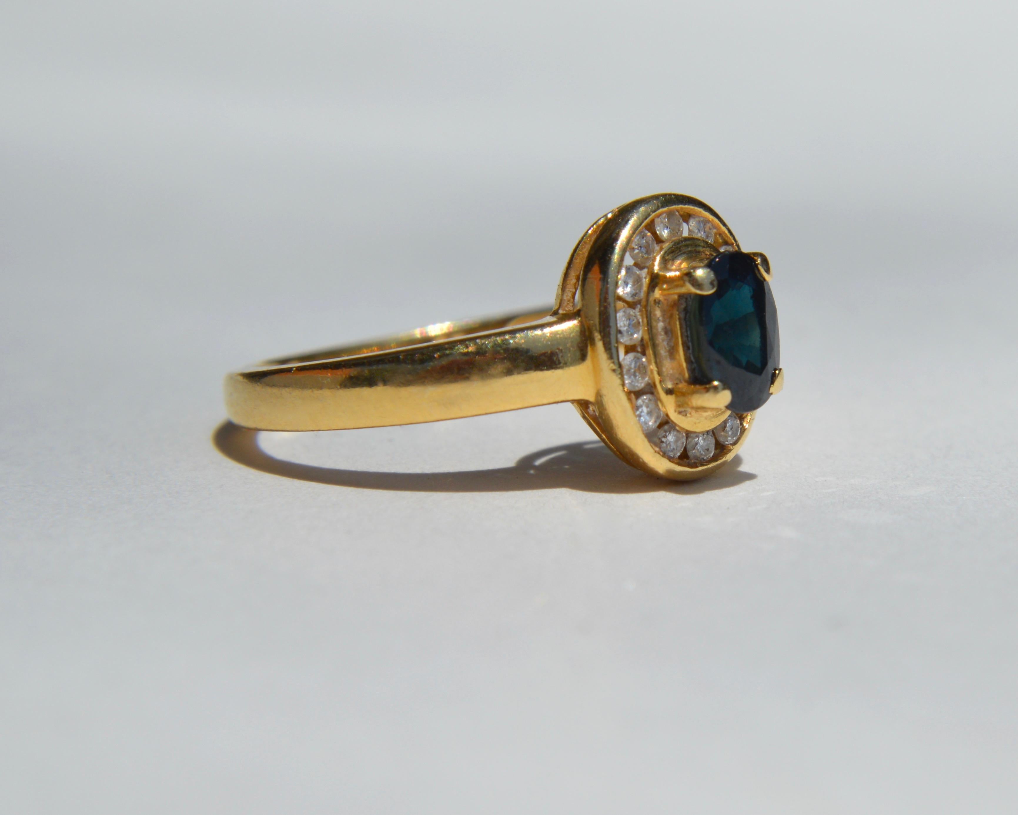 Beautiful midcentury era circa 1960s 14K yellow gold .35 carat natural oval cut unheated sapphire and diamond halo ring. 13 total round cut diamonds, each .015 carats (1.5mm). Diamond color F, clarity VS1. Size 6.75, can be resized by a jeweler.