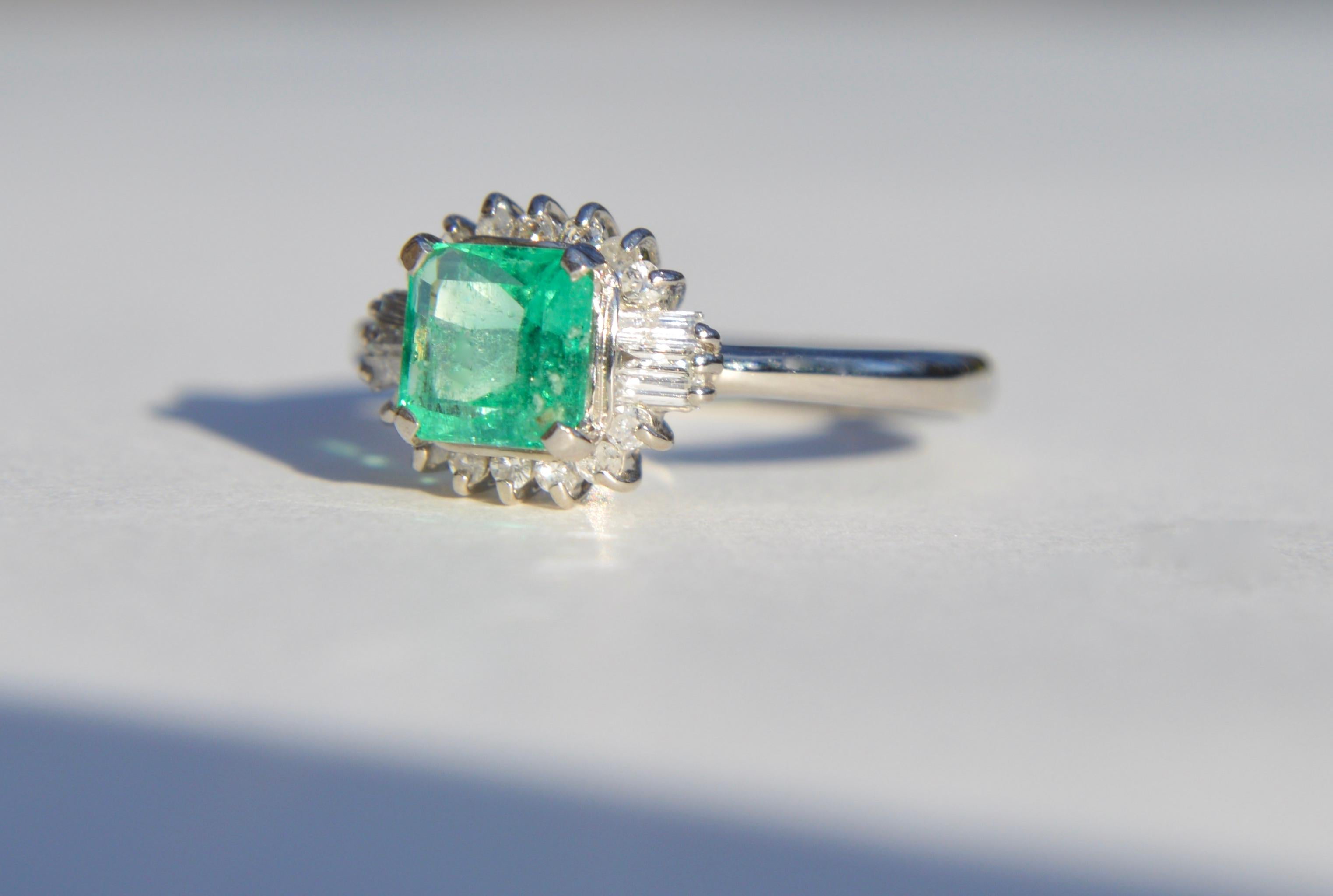 Beautiful vintage circa 1950s midcentury era .71 carat princess cut Colombian emerald ring with single cut round and baguette diamond halo in solid platinum. Ring is marked as PT900 for platinum. Size 6.25, can be resized by a jeweler. Emerald