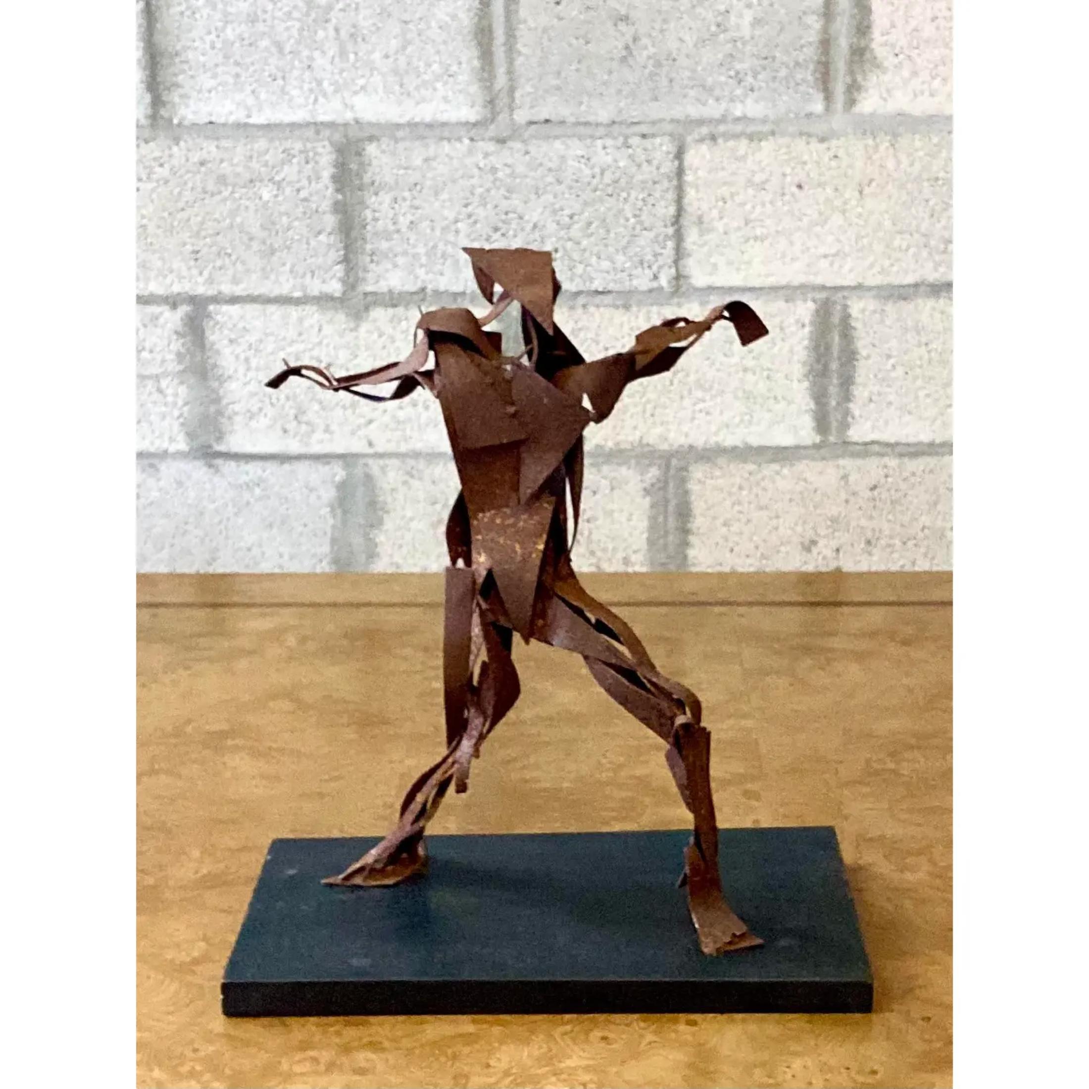 Vintage Midcentury abstract sculpture. Rusted steel in layers create the composition of a man with arms extended. Acquired from a Palm Beach estate
