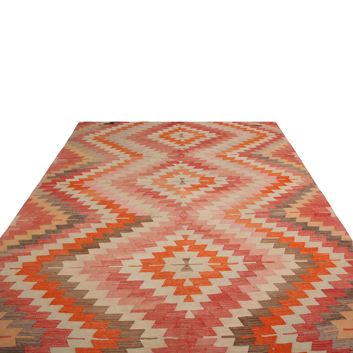 Handwoven in Turkey originating between 1950-1960, this vintage midcentury wool Kilim hails from the Afyon province, enjoying a Classic variation of the diamond pattern known to enjoy rare and entirely individualistic variations of colorway in every