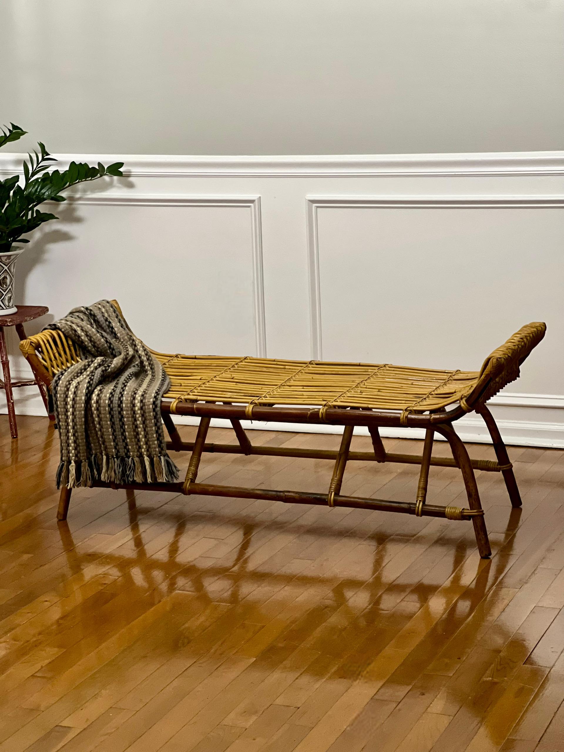 Classic Bohemian French Riviera style bamboo and rattan bench in the manner of Franco Albini, circa 1960s. Incredibly versatile bench with a blend of natural materials and organic beauty with a balanced form. Great in a hallway, entryway or as a