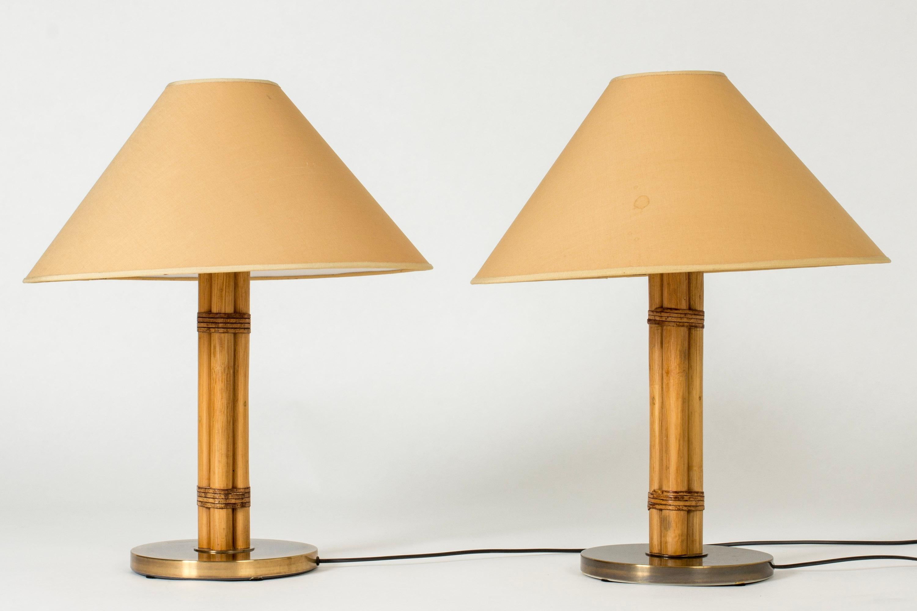 Very cool pair of table lamps from Bergboms, with rustic bamboo stems with leather details. Brass bases and original, wide shades in a terracotta nuance.