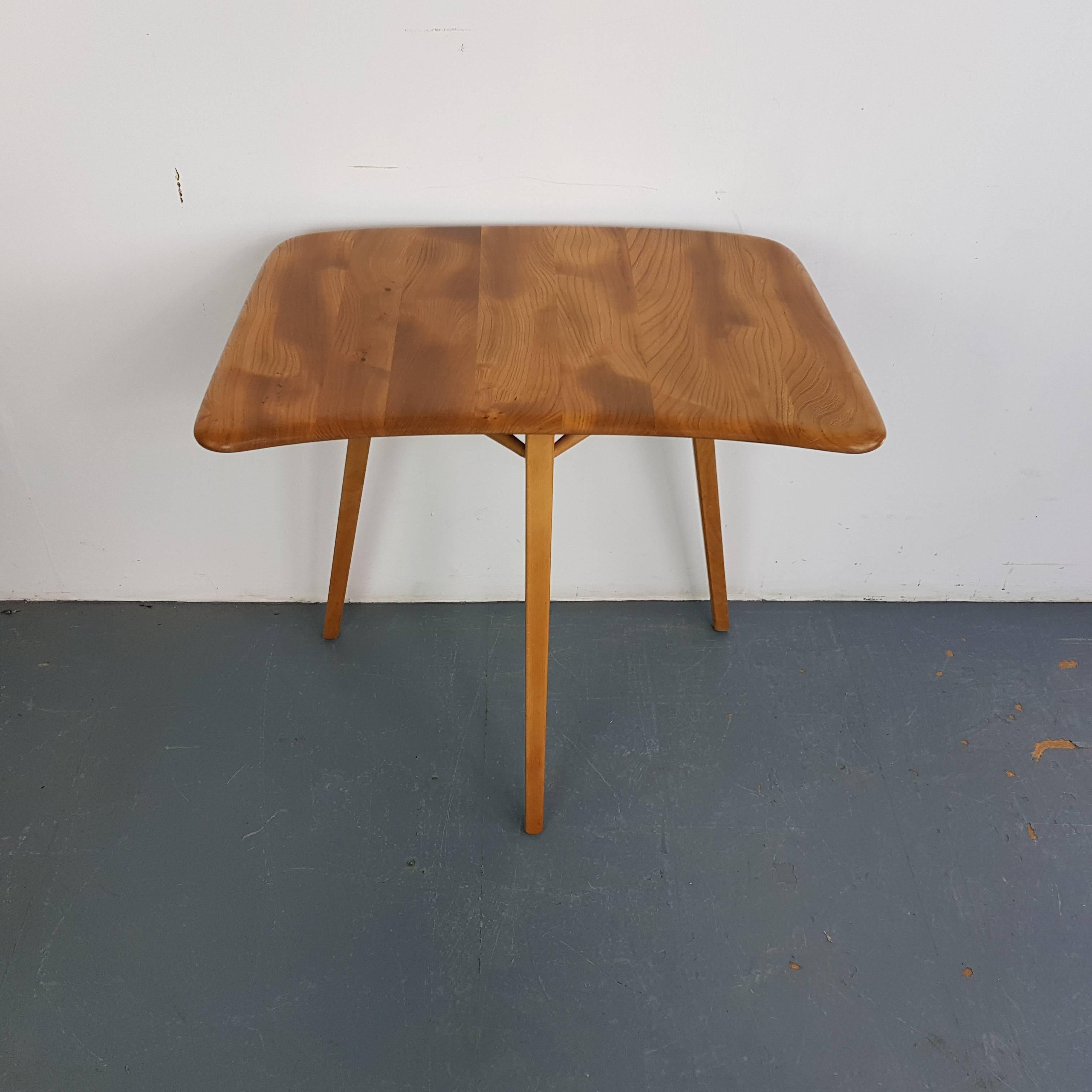 Very rare vintage (mid 60s) Ercol plank table desk extension. Elm and beech. Could be used as a stand alone desk or (as pictured) to extend an Ercol plank table.

In very good vintage condition. It's a vintage item, so has some general age-related