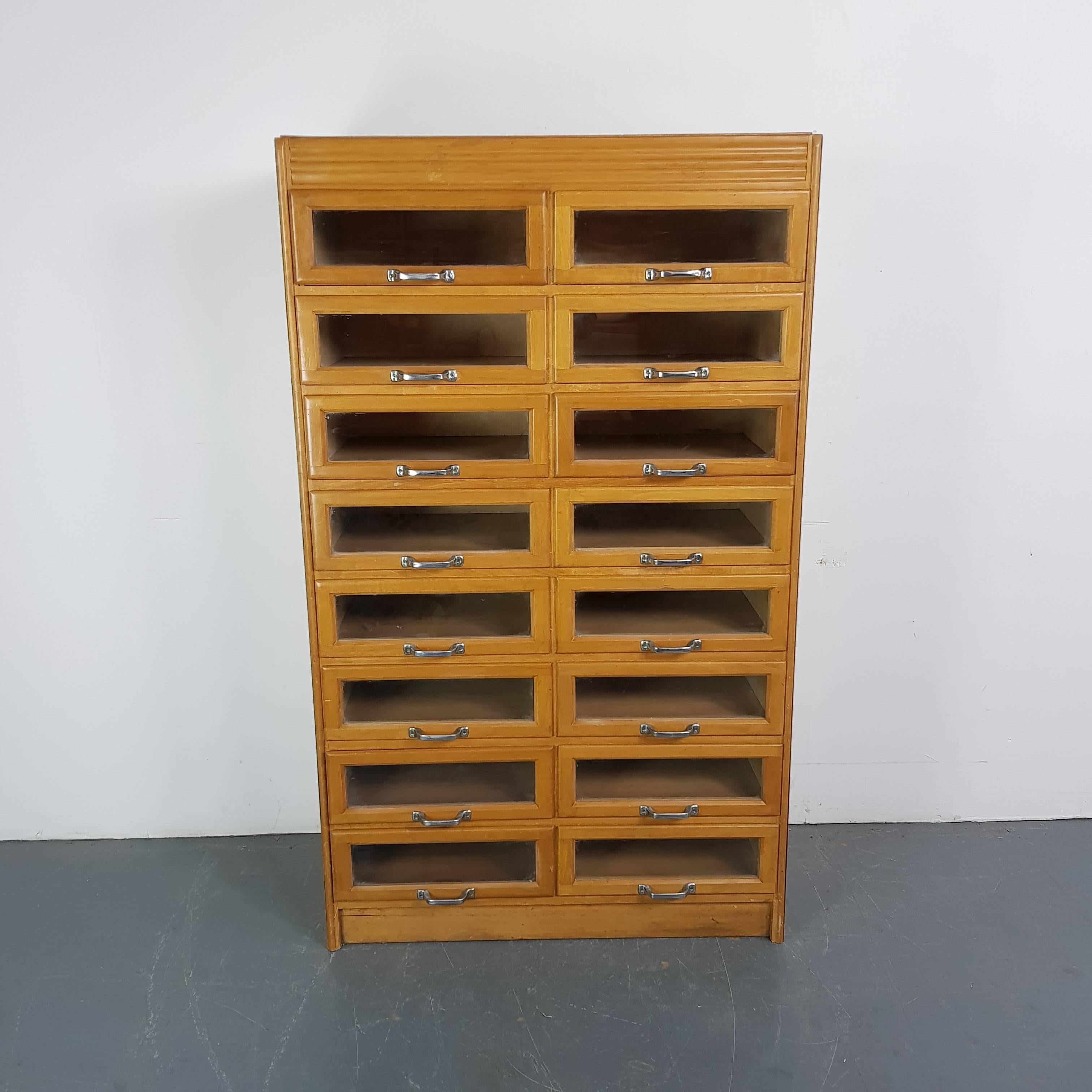 16-drawer haberdashery shop cabinet. 

It has 16 glass fronted drawers all with original metal handles.

Approximate dimensions:

Height: 153cm

Width: 91cm

Depth: 49cm

Glass fronted drawers: 40cm W x 38cm D x 13cm H.

Overall, in