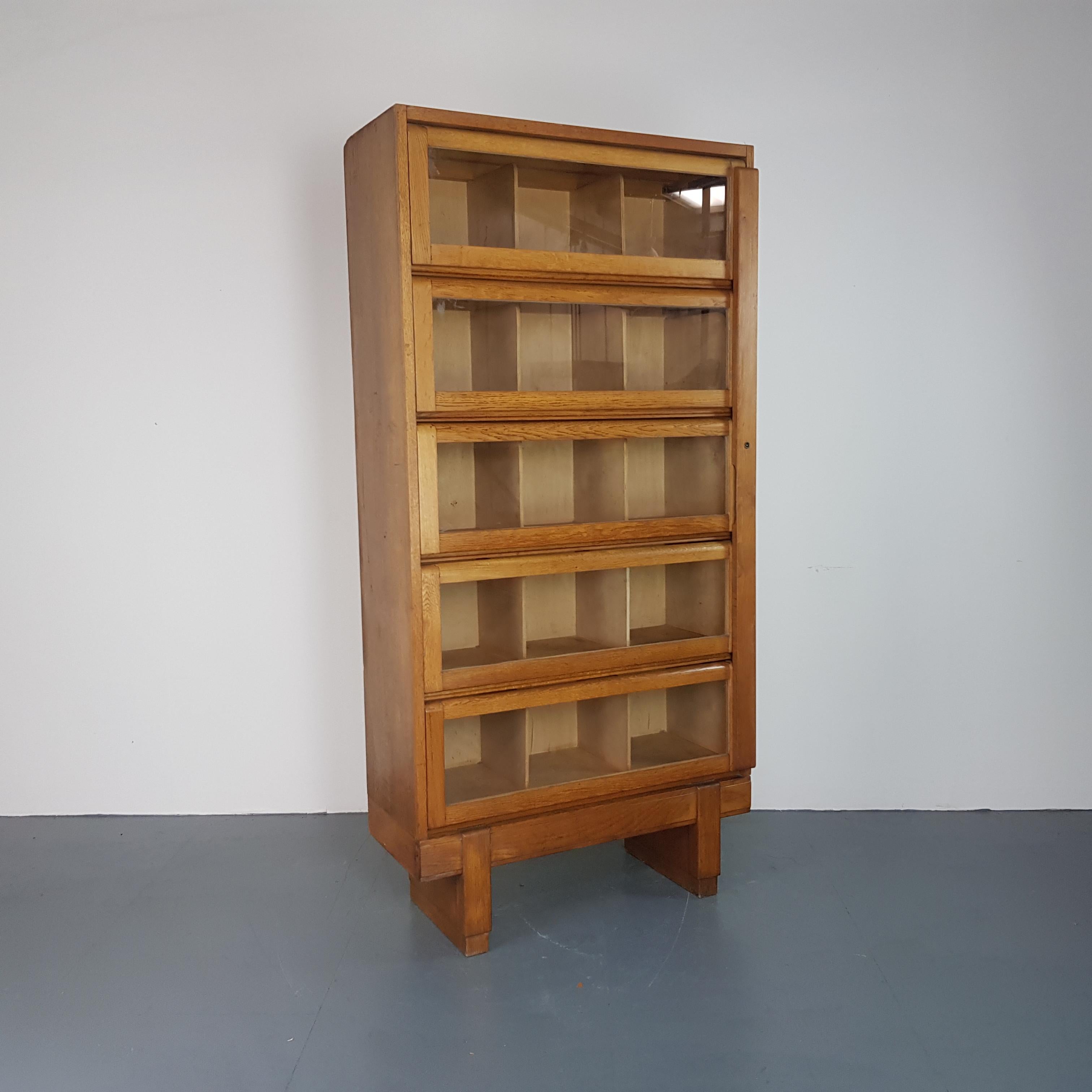 Wonderful vintage bookcase designed and made in the UK by Staverton (Dartington, South Devon). In the middle of the last century, Staverton manufactured furniture ranges for the Crown Suppliers and this developed into contracts for Crown Court