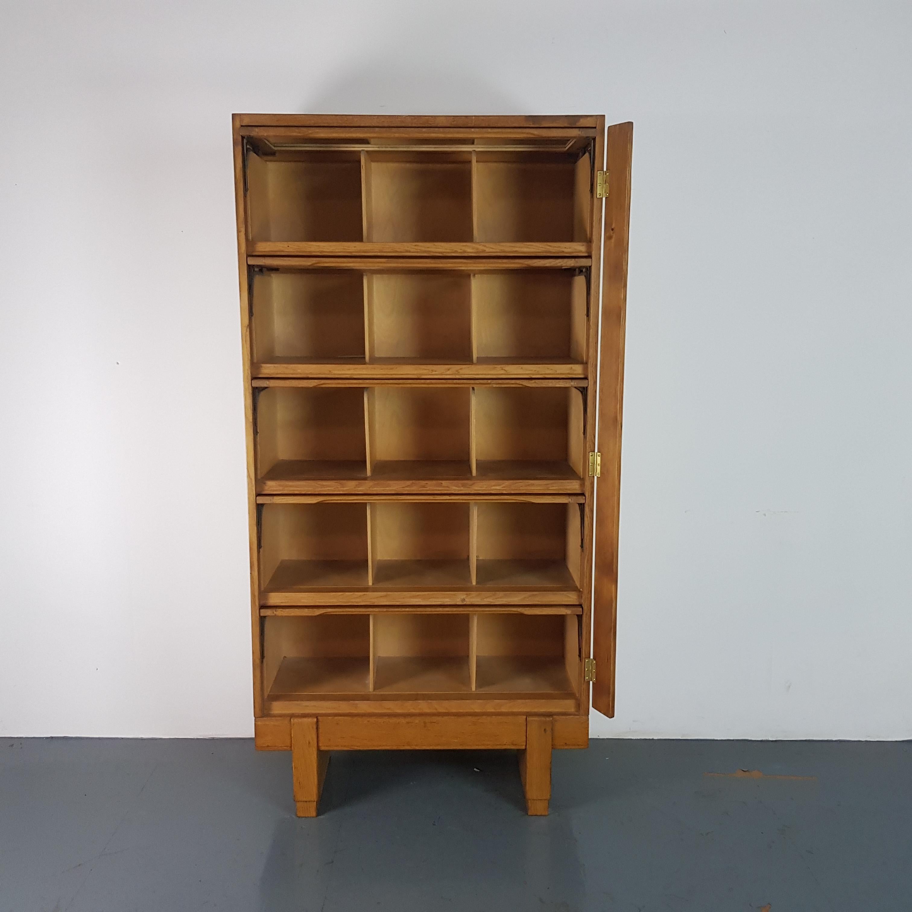 Wonderful vintage bookcase designed and made in the UK by Staverton (Dartington, South Devon). In the middle of the last century, Staverton manufactured furniture ranges for the Crown Suppliers and this developed into contracts for Crown Court