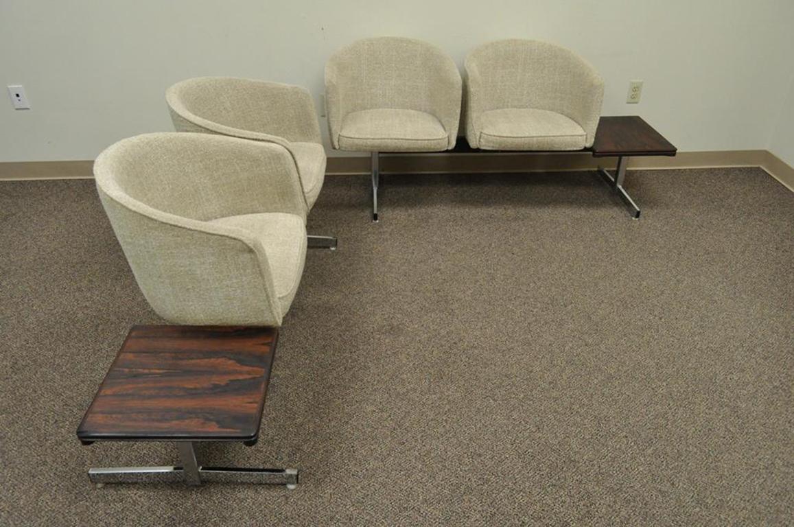 Vintage two-piece Danish modern seating arrangement. Item features each section consists of two barrel back chairs and an attached rosewood end or side table, table marked 