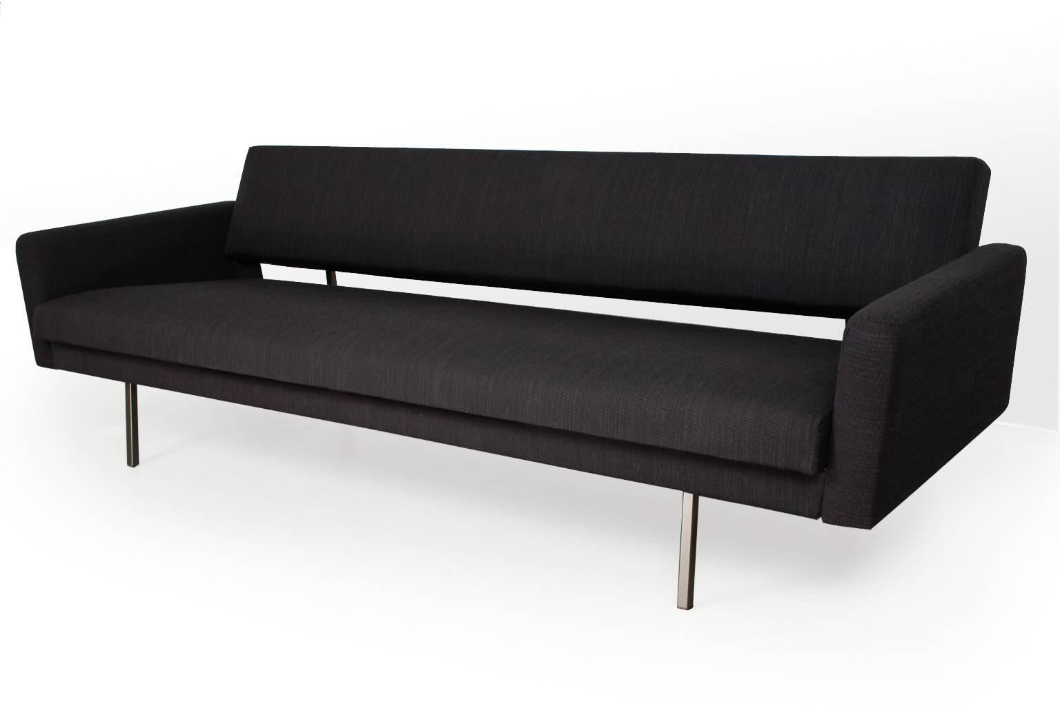 Original Rob Parry Lotus 65 with upholstered armrests on a grey lacquered metal frame, designed by Rob Parry for the Dutch editor Gelderland in the 1960s. The sofa is new upholstered in dark brown and black melange De Ploeg furniture fabric. The