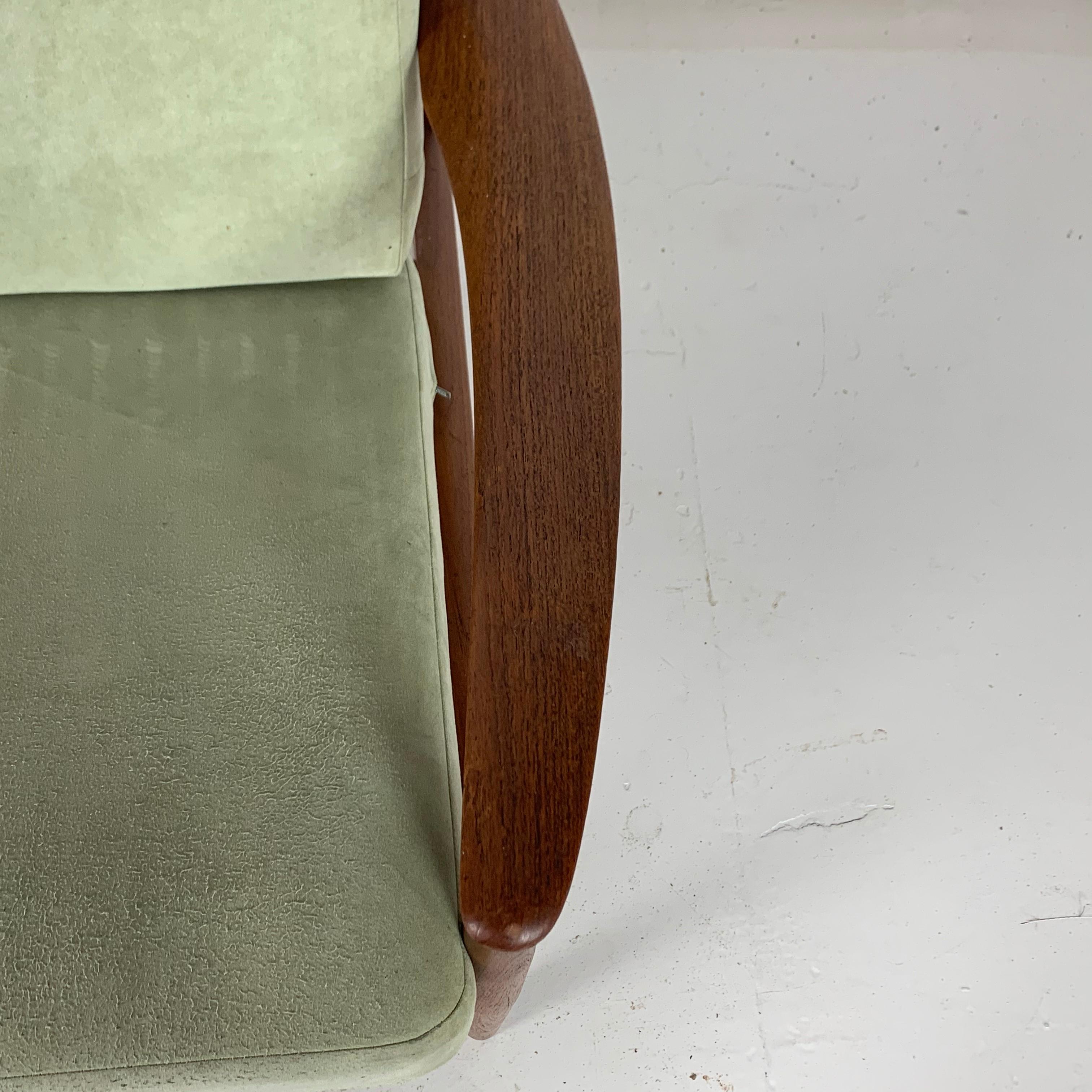 Lovely teak Grete Jalk for France & Son lounge chair made in the 1950s-1960s, with spring-loaded cushions upholstered in green suede-feel fabric. Beautiful sculpted arms.

Approximate dimensions: Height 70.5cm, depth 74cm, width 76cm.