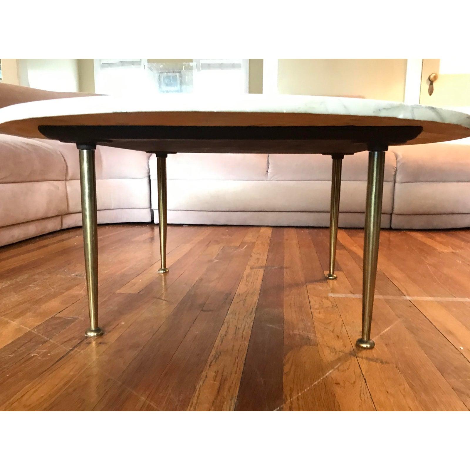 The most beautifully-veined marble cocktail table, with sultry brass stiletto legs. Imported from Italy in the 1950s, per original owner. Feel free to request an independent shipping quote, or for more detailed images.
