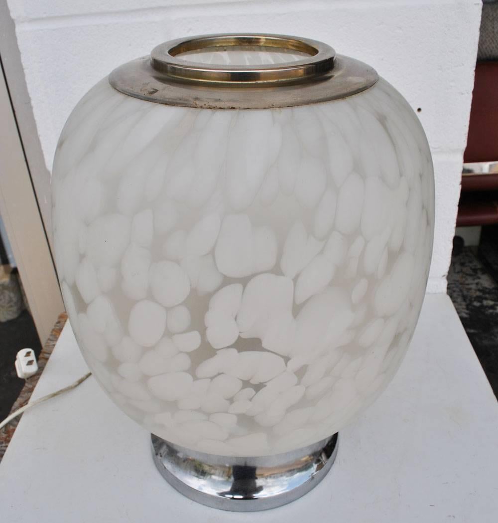 Vintage Midcentury Italian Table Lamp by Vistosi, Murano, Italy. 

Vintage spherical in patterned satin white and clear Murano glass, mounted on chrome base. The lamp uses three standard base light bulbs.