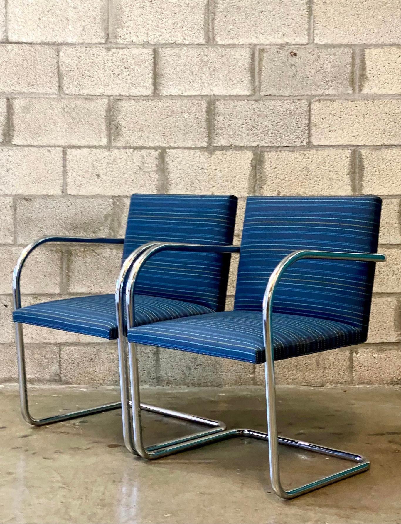 Iconic pair of MCM Knoll chairs. The tubular version of the coveted BRNO design. A cantilevered profile with brilliant blue broken stripe upholstery.